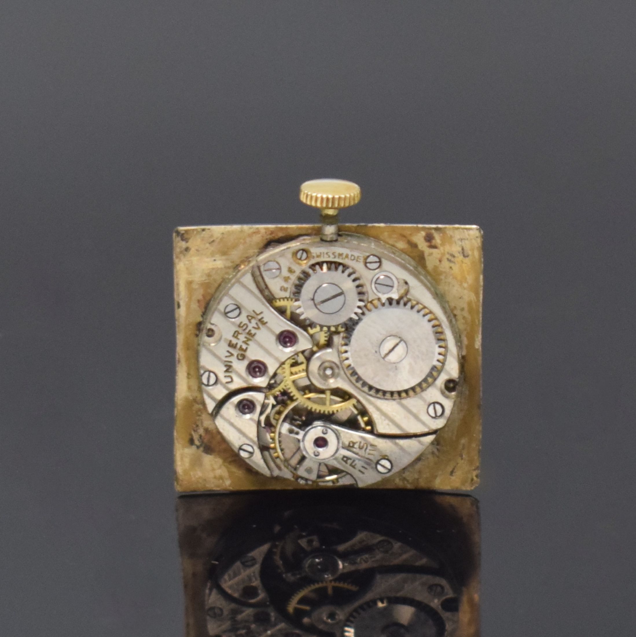 Detail d: UNIVERSAL GENEVE rechteckige Armbanduhr in GG 375/000, Schweiz / England um 1935, Handaufzug, 2-tlg. Geh., Boden aufgedr., schwarzes Zifferbl. rest., ...