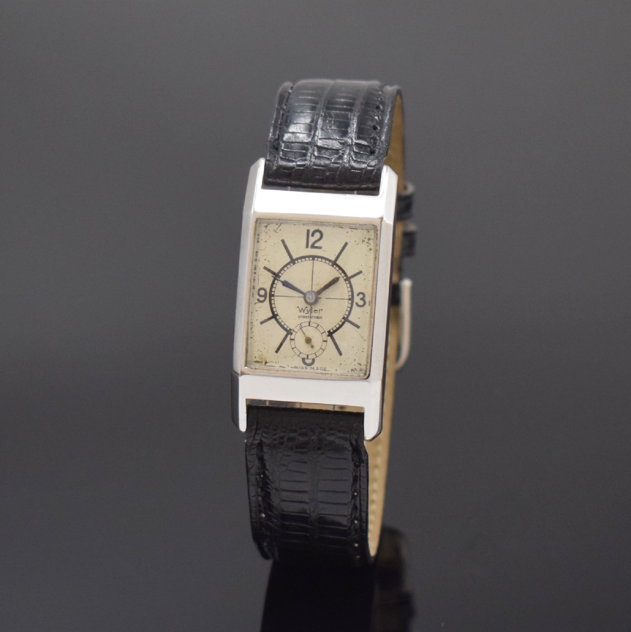 WYLER seltene rechteckige Armbanduhr mit rückseitigem Aufzug, Schweiz um 1935, Handaufzug, verchromtes Scharniergeh., im Boden Krone f. Aufzug u. ...