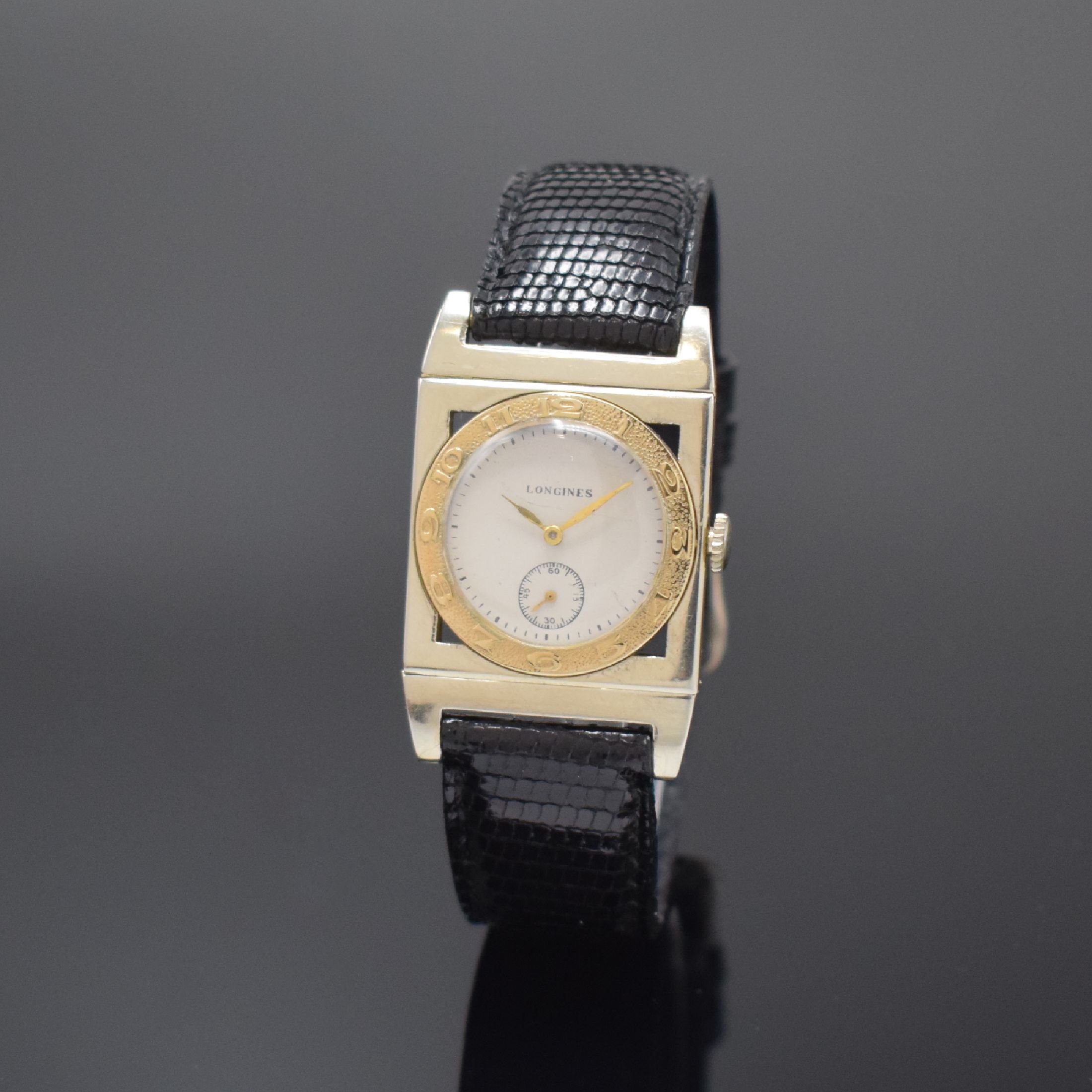 LONGINES seltene rechteckige Armbanduhr in WG/GG 18k, USA / Schweiz um 1938, Handaufzug, 3-tlg. Geh. m. beweglichen Anstößen, GG-Lünette m. arab. ...
