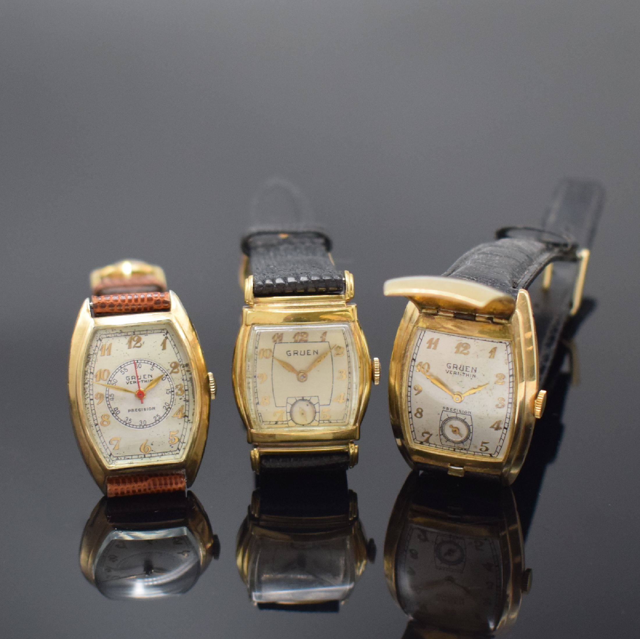 GRUEN 3 10k-goldfilled Armbanduhren, Schweiz / USA um 1945, Handaufzug, 2-tlg. tonneau- förm. Geh., Böden in Stahl / goldfilled aufgedr., silb. ...