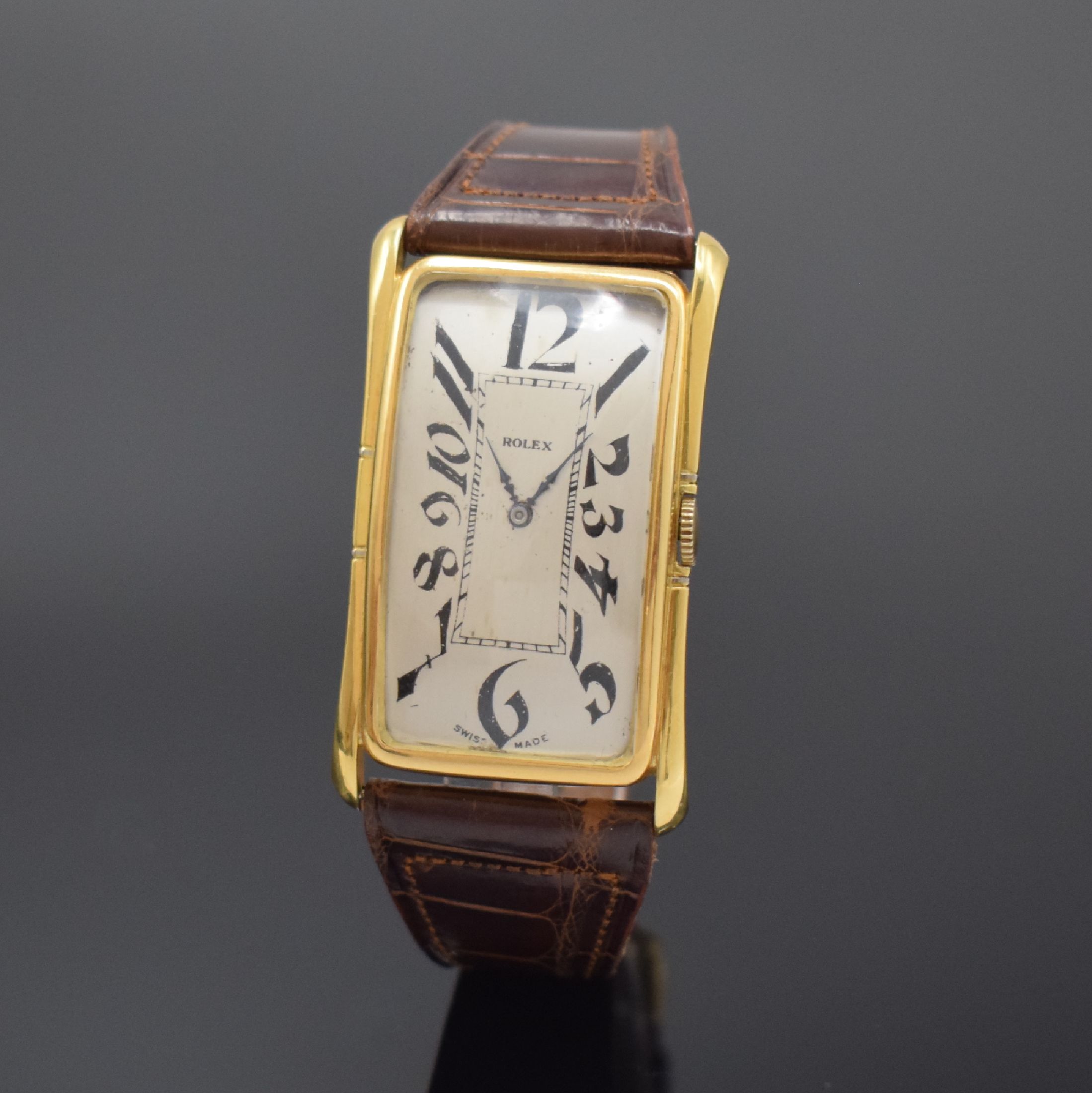ROLEX große rechteckige Armbanduhr in GG 750/000, Schweiz / England um 1920, Handaufzug, 2-tlg. Geh. m. geschweiften Seiten, Boden m. London ...