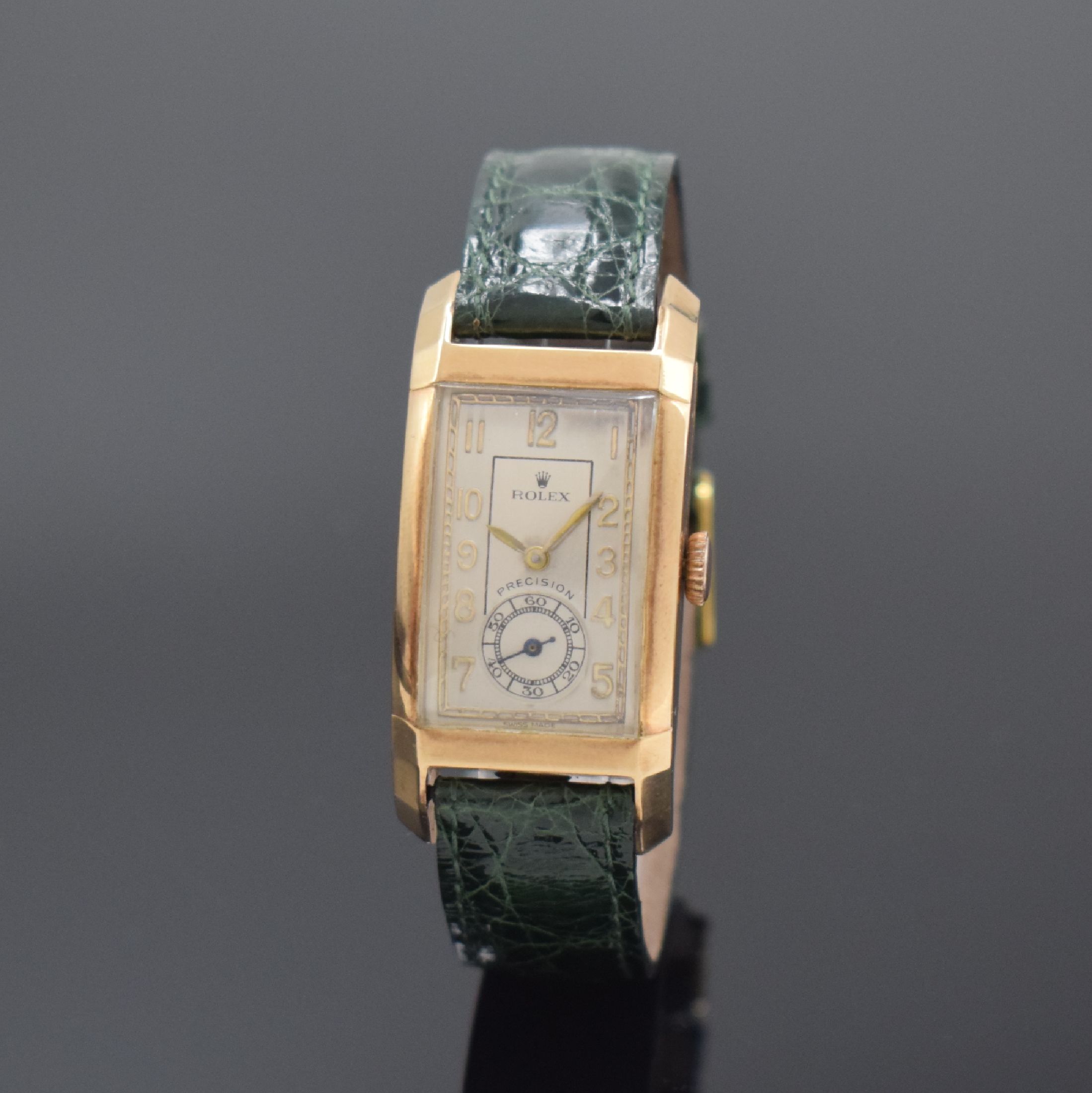 ROLEX rechteckige Armbanduhr Referenz 3059 in RG 9k, Handaufzug, stark gebogenes 2-tlg. Geh., Boden aufgedr., silb. Zifferbl. rest., vers. Formwerk, ...
