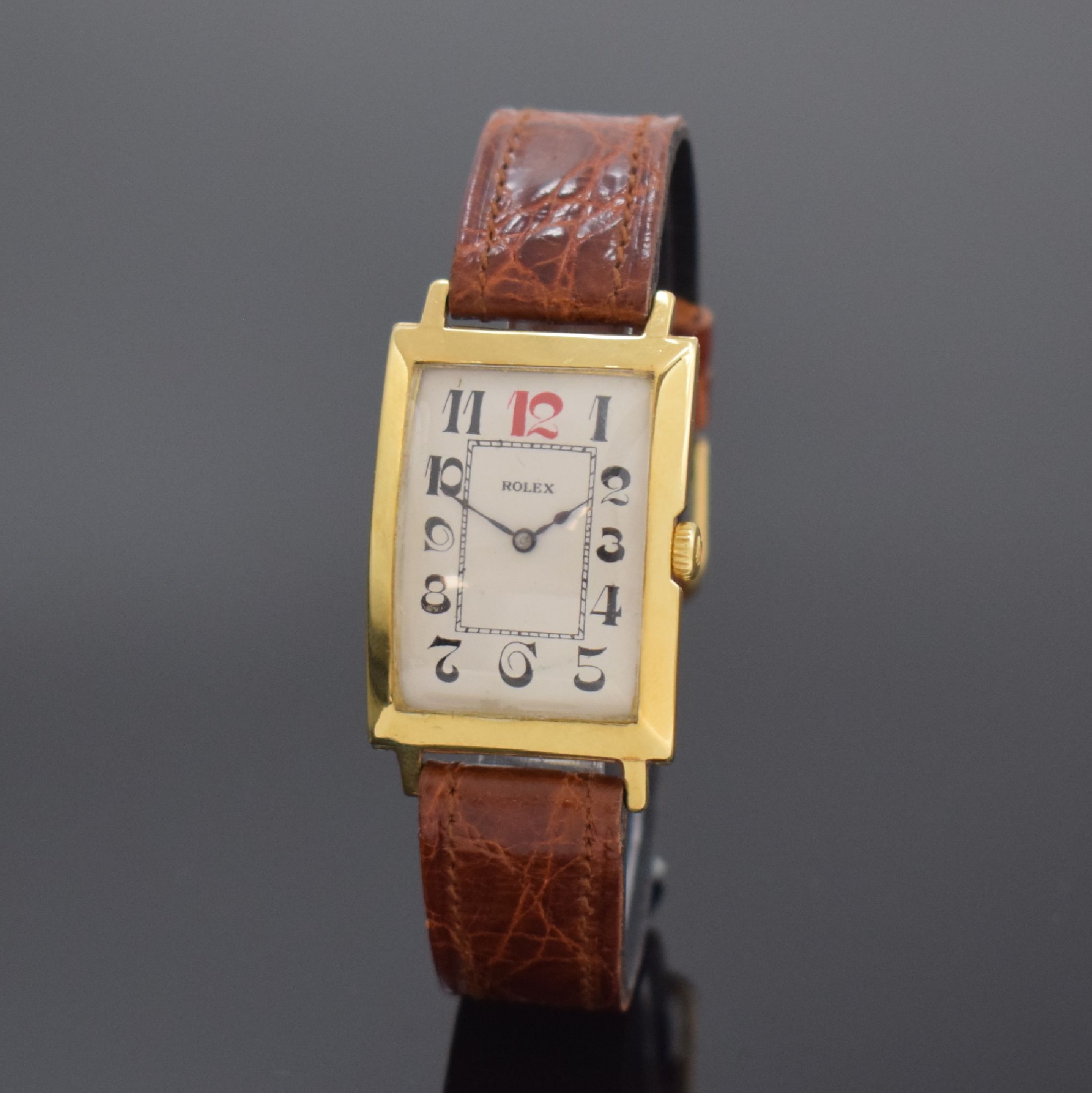 ROLEX rechteckige Armbanduhr in 9k Gelbgold, Schweiz für England um 1930, Handaufzug, gebogenes Scharniergeh., London Import-Stempel v. 1929, silb. ...
