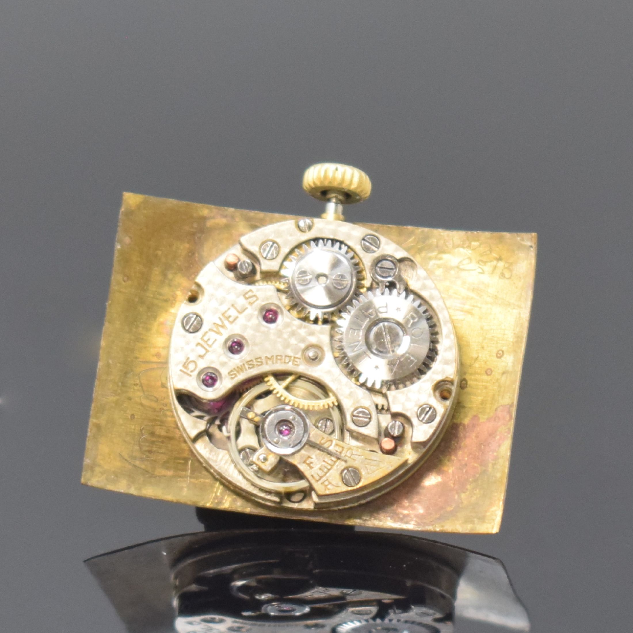 Detail e: ROLEX rechteckige Armbanduhr in 9k Gelbgold, Schweiz für England um 1930, Handaufzug, gebogenes Scharniergeh., London Import-Stempel v. 1929, silb. ...