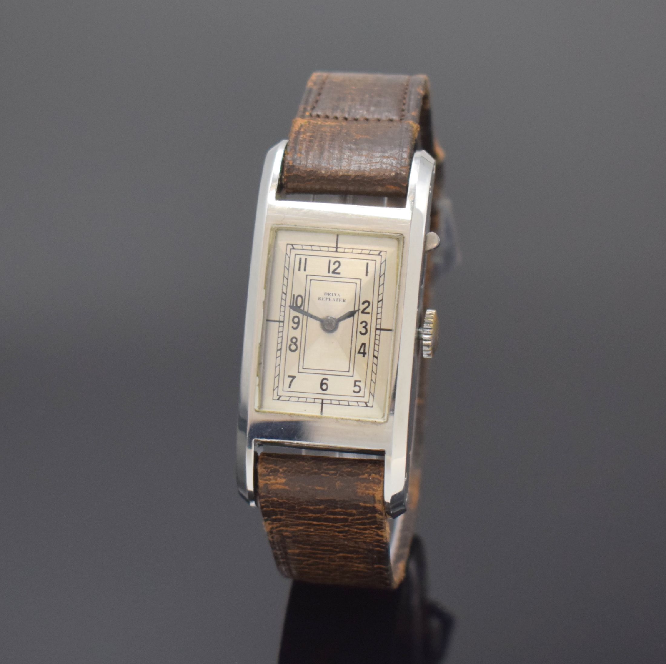 DRIVA Repeater sehr seltene rechteckige Armbanduhr mit 1/4-Repetition in Stahl, Schweiz um 1935, Handaufzug, 2-tlg. Geh., Boden aufgedr., seitl. ...