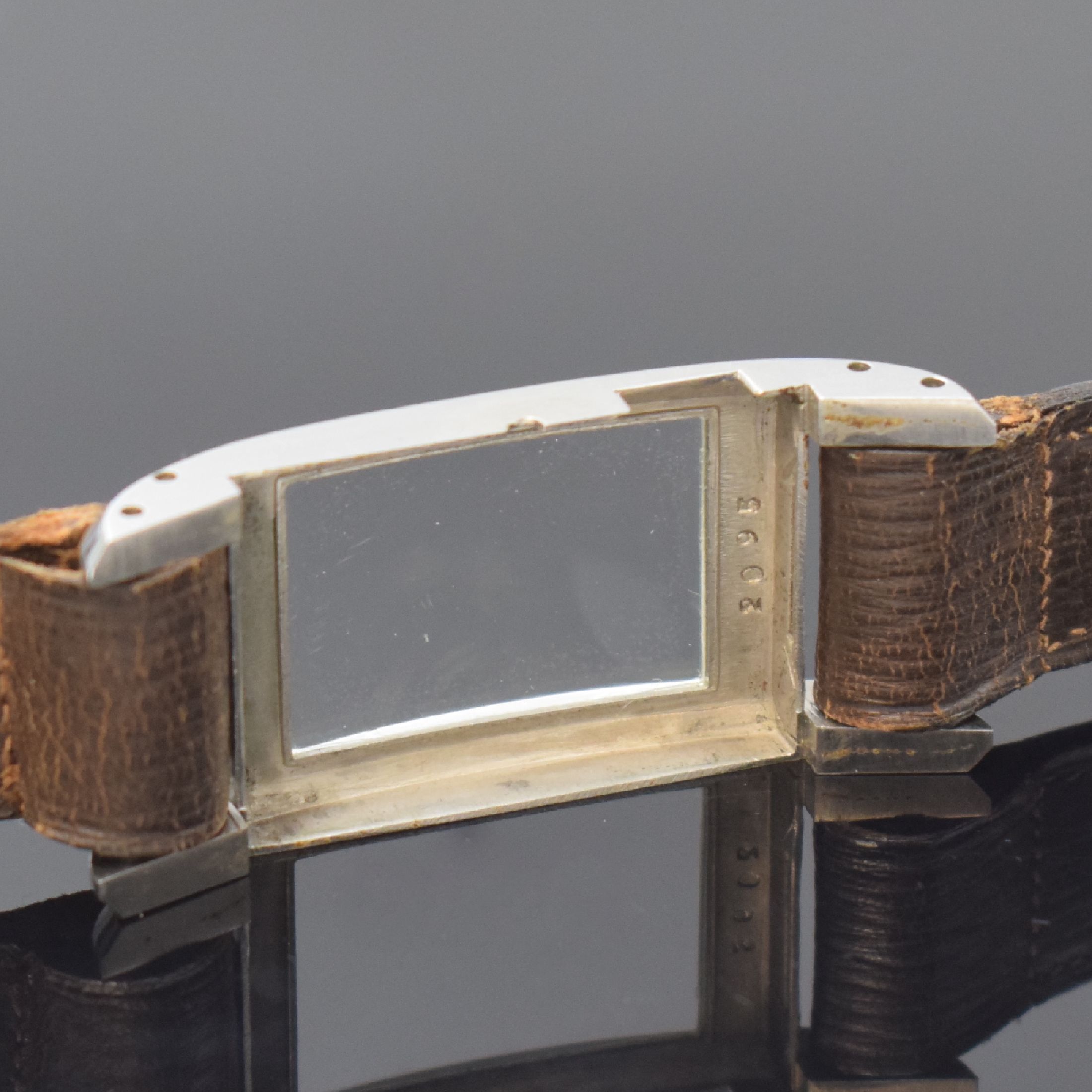 Detail d: DRIVA Repeater sehr seltene rechteckige Armbanduhr mit 1/4-Repetition in Stahl, Schweiz um 1935, Handaufzug, 2-tlg. Geh., Boden aufgedr., seitl. ...