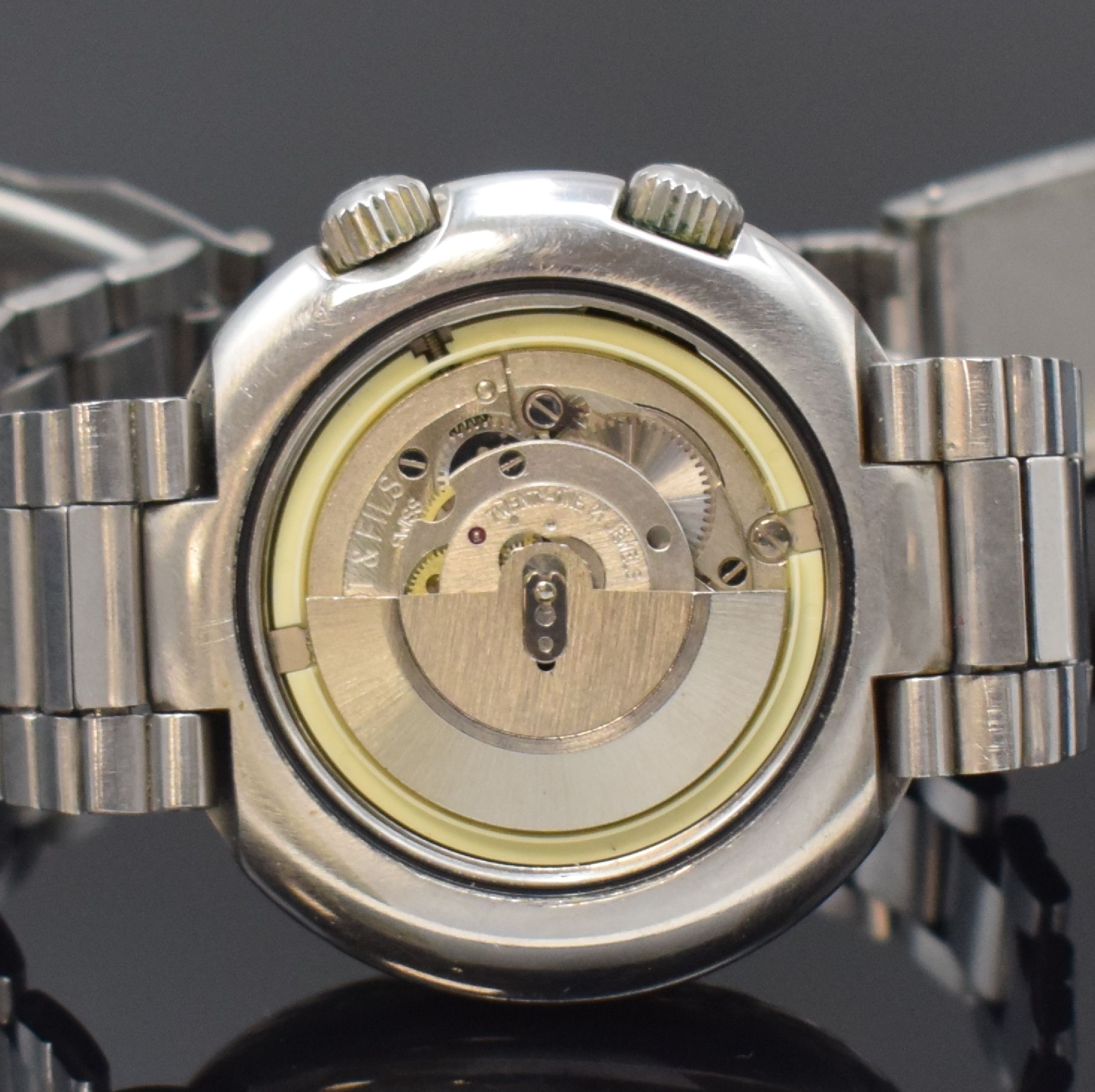 Detail d: TISSOT Navigator T12 Herrenarmbanduhr mit Weltzeitanzeige Referenz 44596, Schweiz um 1970, Automatik, massives Edelstahlgeh. inkl. neutr. Gliederband ...