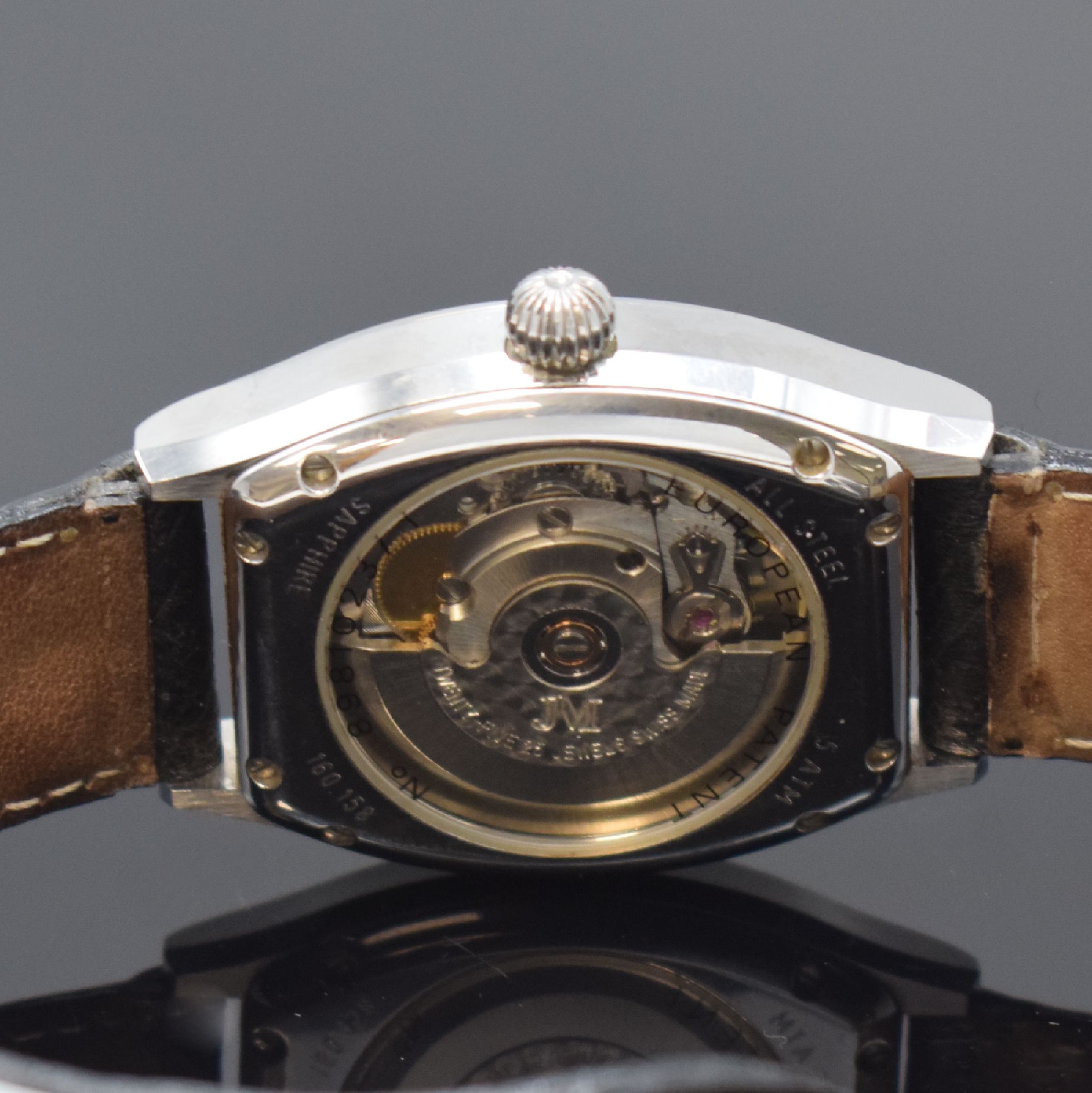 Detail d: JEAN MARCEL Herrenarmbanduhr mit wandernder springender Stunde Referenz 160.158, Schweiz um 1995, Automatik, tonneauförmiges, beids. vergl. ...