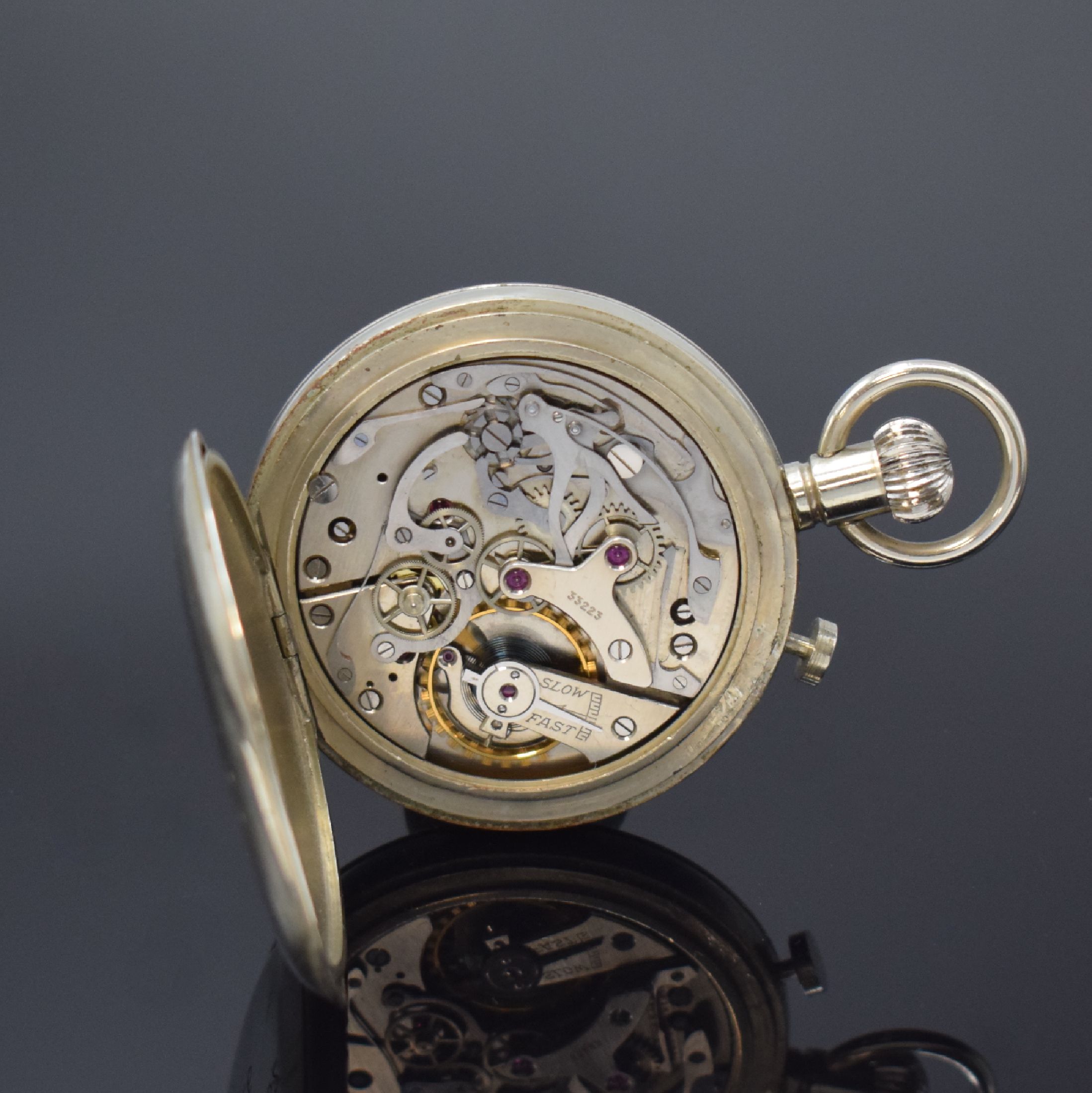 Detail d: Einhandstopper mit Schleppzeigerfunktion, Schweiz 1950er Jahre, Nickelgeh. dell., Geh.- Boden mit Registr.-Gravur, ungedeutet, Emailzifferblatt m. ...