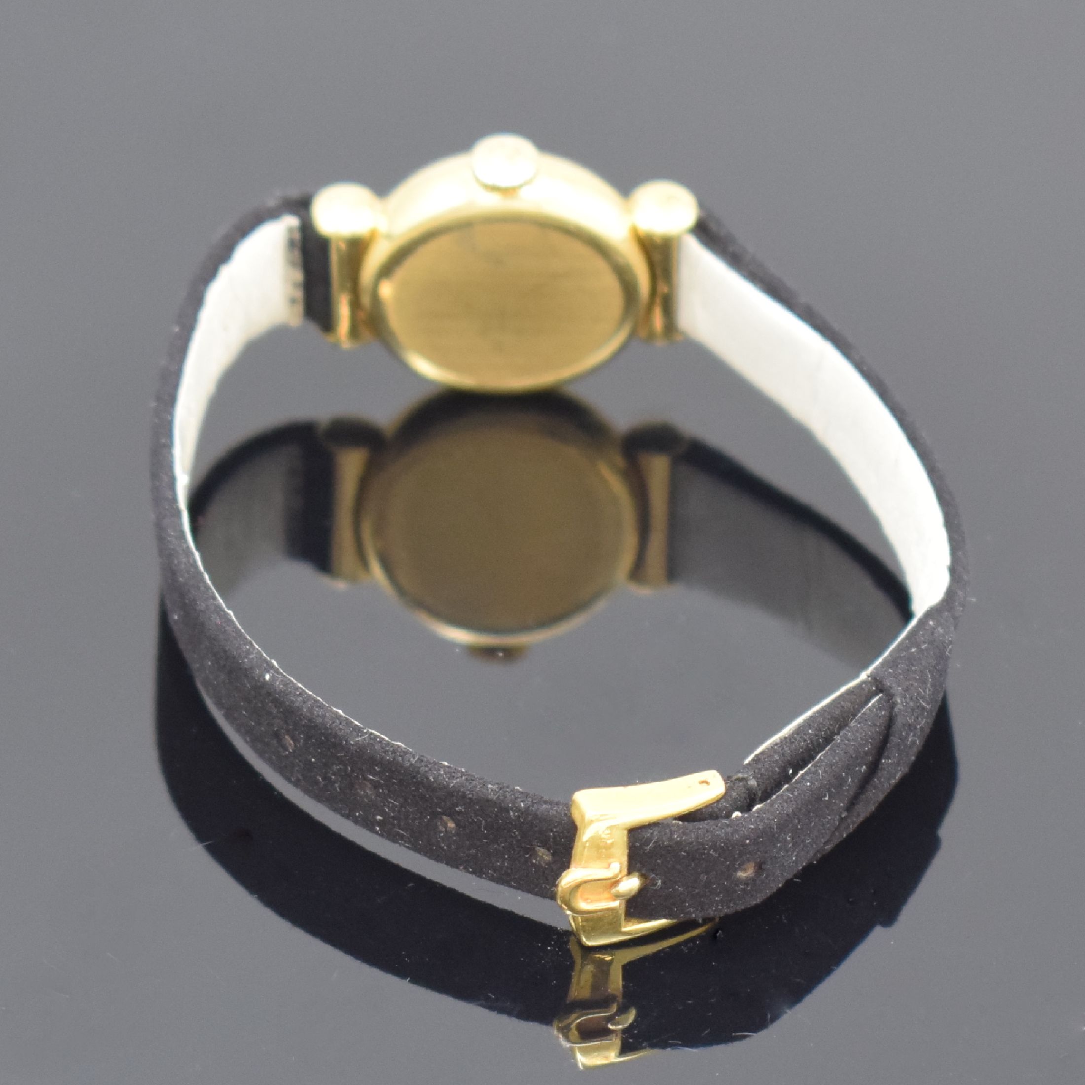 Detail d: OMEGA Damenarmbanduhr in GG 750/000, Handaufzug, Schweiz um 1962, 2-teil. Geh. inkl. orig. Lederband m. verg. orig. Dornschl., Boden aufgedr., silb. ...