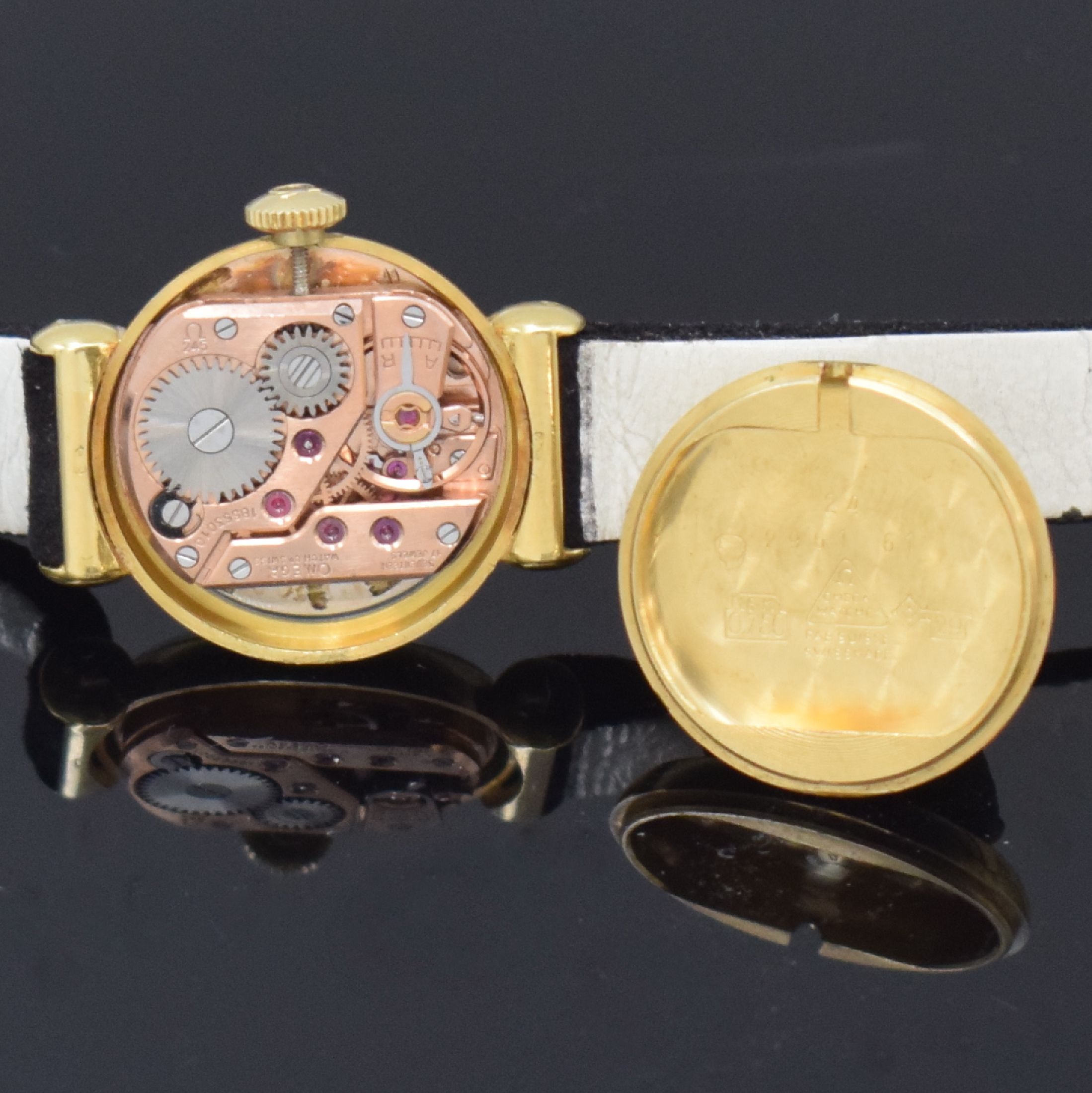 Detail e: OMEGA Damenarmbanduhr in GG 750/000, Handaufzug, Schweiz um 1962, 2-teil. Geh. inkl. orig. Lederband m. verg. orig. Dornschl., Boden aufgedr., silb. ...
