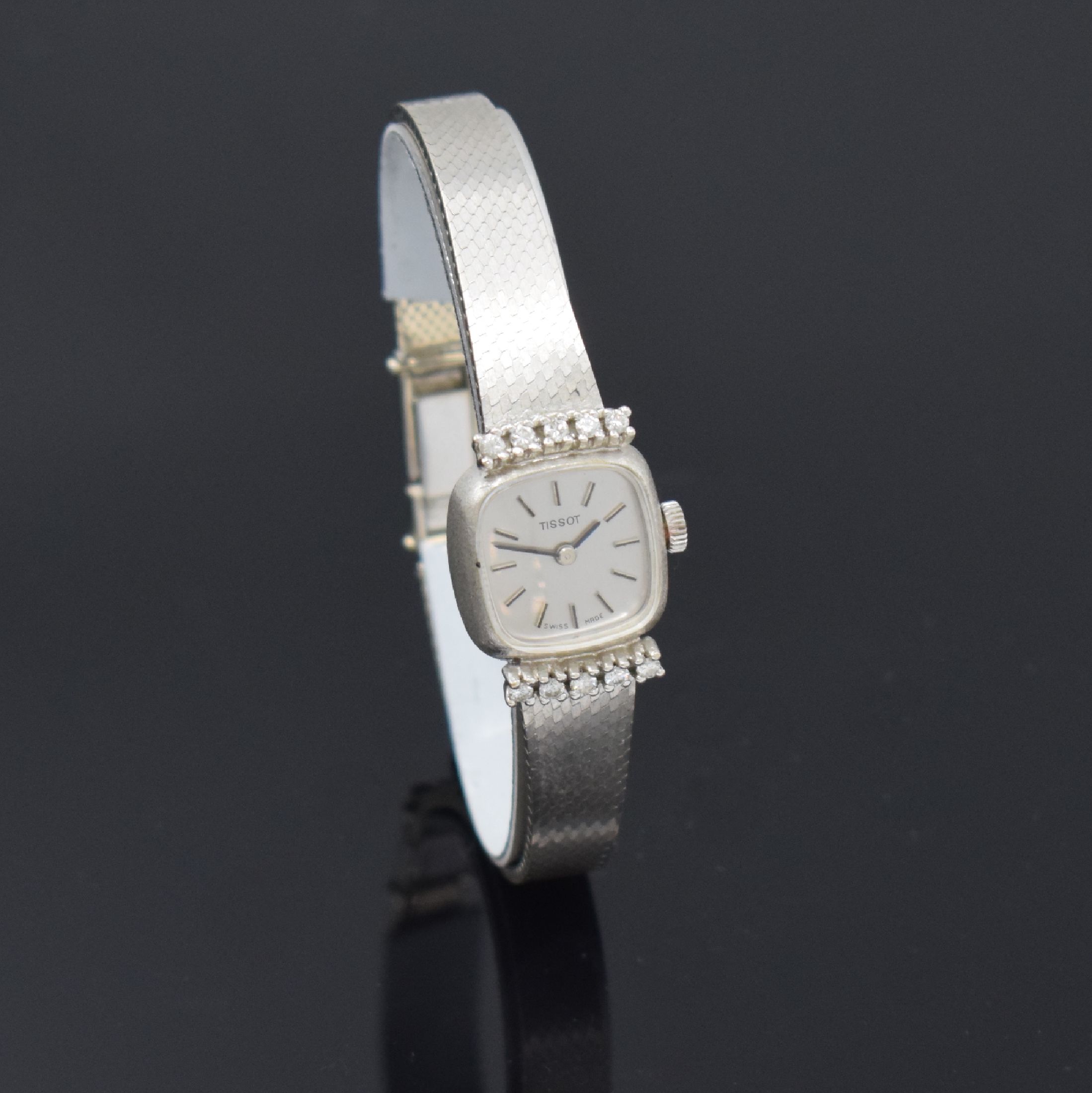 Detail b: TISSOT Damenarmbanduhr in WG 585/000, Handaufzug, Schweiz um 1970, Geh. bei 6 und 12 mit 10 Diamanten bes., Boden aufgedr., vers. Zifferbl. m. ...
