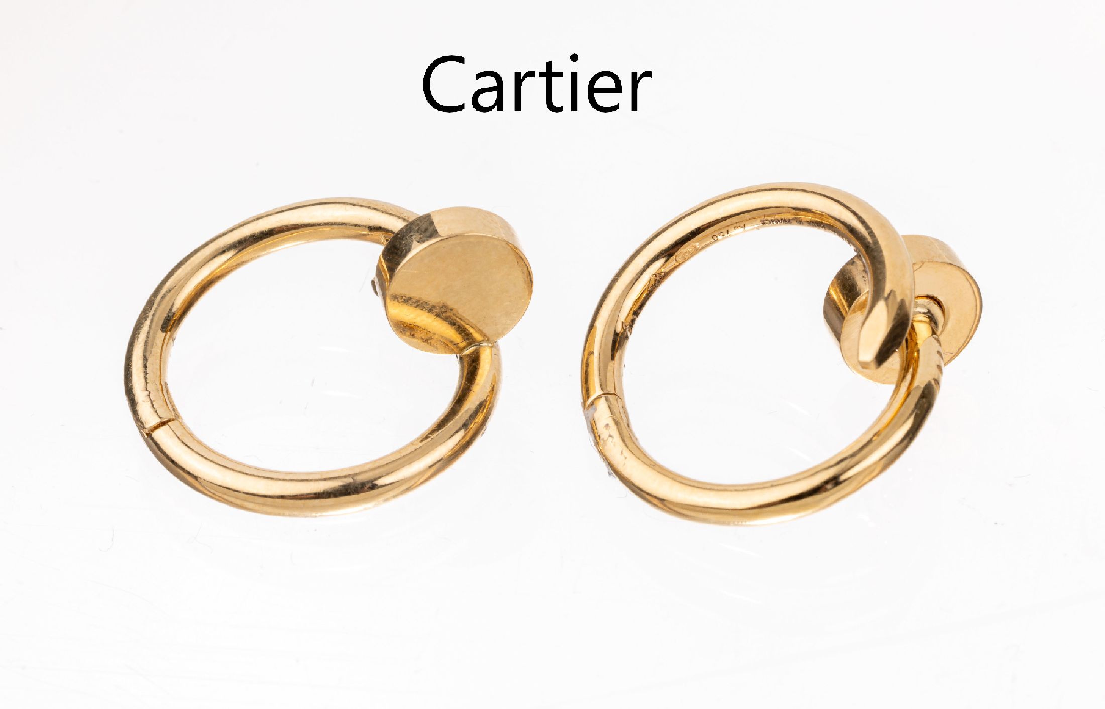 Paar 18 kt Gold CARTIER Manschettenknöpfe, "juste un clou", GG 750/000, pol., sign. und num., ca. 23 x 21 mm, Neupreis 4950.- Euro