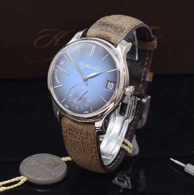 26731160a - H. Moser & Cie. very fine & rare 18k white gold gents wristwatch Endevour Perpetual Calendar reference 1341-0207, manual winding, on both sides glazed case back screwed-down 4 -times, original leather strap with original 18k white gold deployant clasp, blue Fume-dial with raised indices, display of hours, minutes, constant second, date, month & power reserve indicator, on movement leap year indication, correction at the sides in case inserted, diameter approx. 41 mm, original box, setting pin & papers, condition 1-2