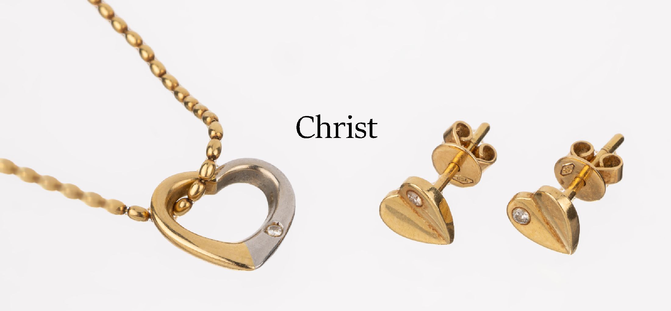 18 kt Gold Schmuckset "Herzen", GG 750/000 und Platin 950, best. aus: 1 Anhänger, Platin und GG, Hersteller CHRIST, mit kl. Brillant, an ...