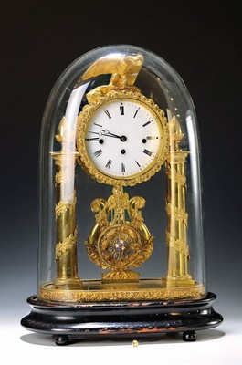 Image 26731207 - Table clock. so-called anniversary clock, withViennese chime, Habsburg Monarchy, around 1830/40, profiled wooden base, orig. Mineral glass dome, brass casing in portal clock shape, conical columns surrounded by leaves, eagle crown, stylized harp behind pendulum, floral bezel, enamel dial (min.dam.) massive Brass plate movement, spring limits/positions removed, lever escapement with thread suspension of the decorative pendulum, strike every quarter of at hour on a small gong with subsequent strike of the previous hour on a large gong, running time, approx /housing 2-3 , decorative