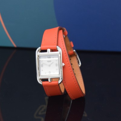 Image HERMES ladies wristwatch series Cape Cod reference CC1.210a, stainless steel case including original leather strap with original buckle, quartz, case back 4-times screwed, mother of pearl dial with 8 diamond indices, measures approx. 33 x 23 mm, Hermes storage back enclosed, unworn stock, condition 1-2