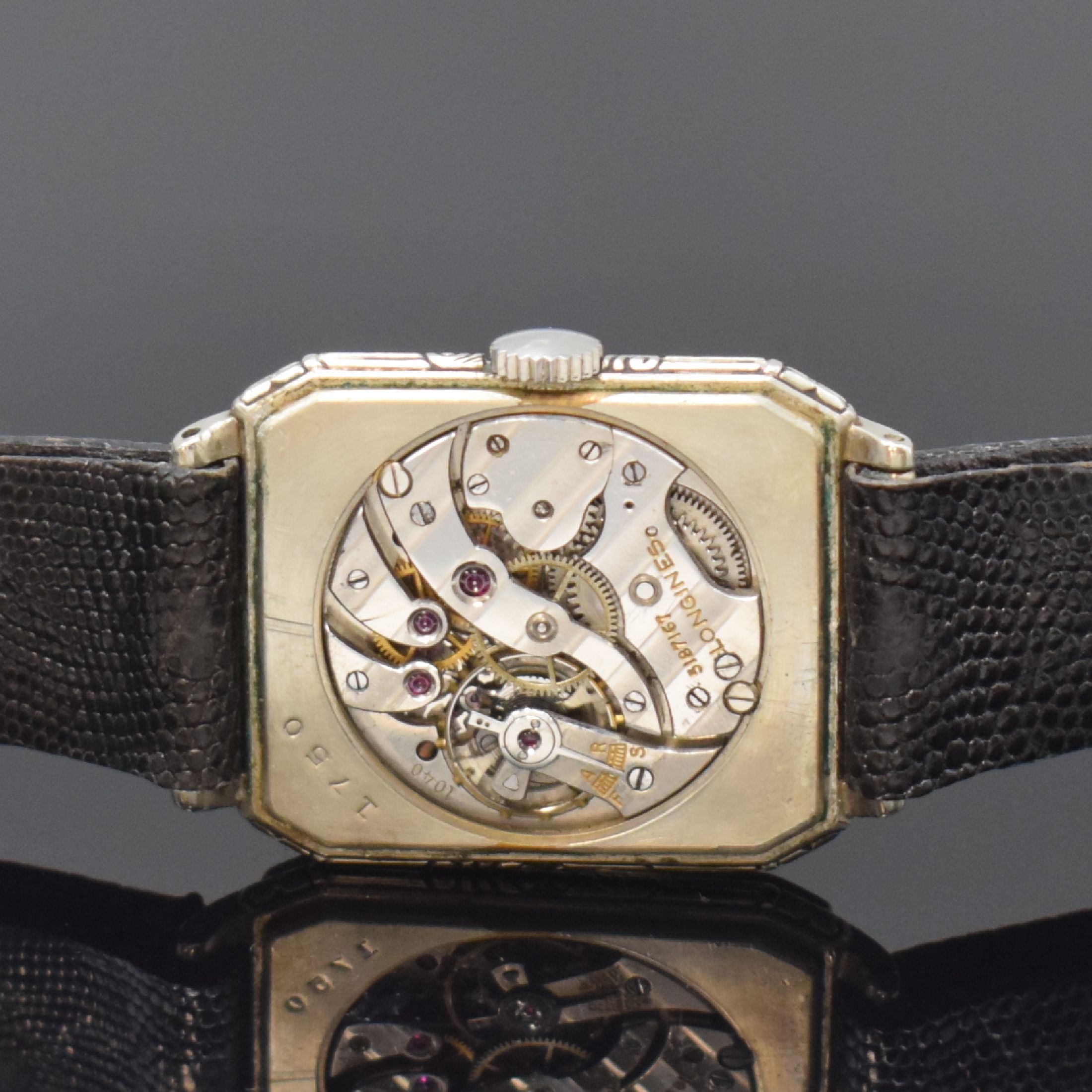 Detail e: LONGINES vergoldete Armbanduhr, Schweiz/USA um 1929, Handaufzug, Geh. teils grav., Boden aufgedr., schwarzes Zifferbl. m. arab. Zahlen, silb. Zeiger, ...