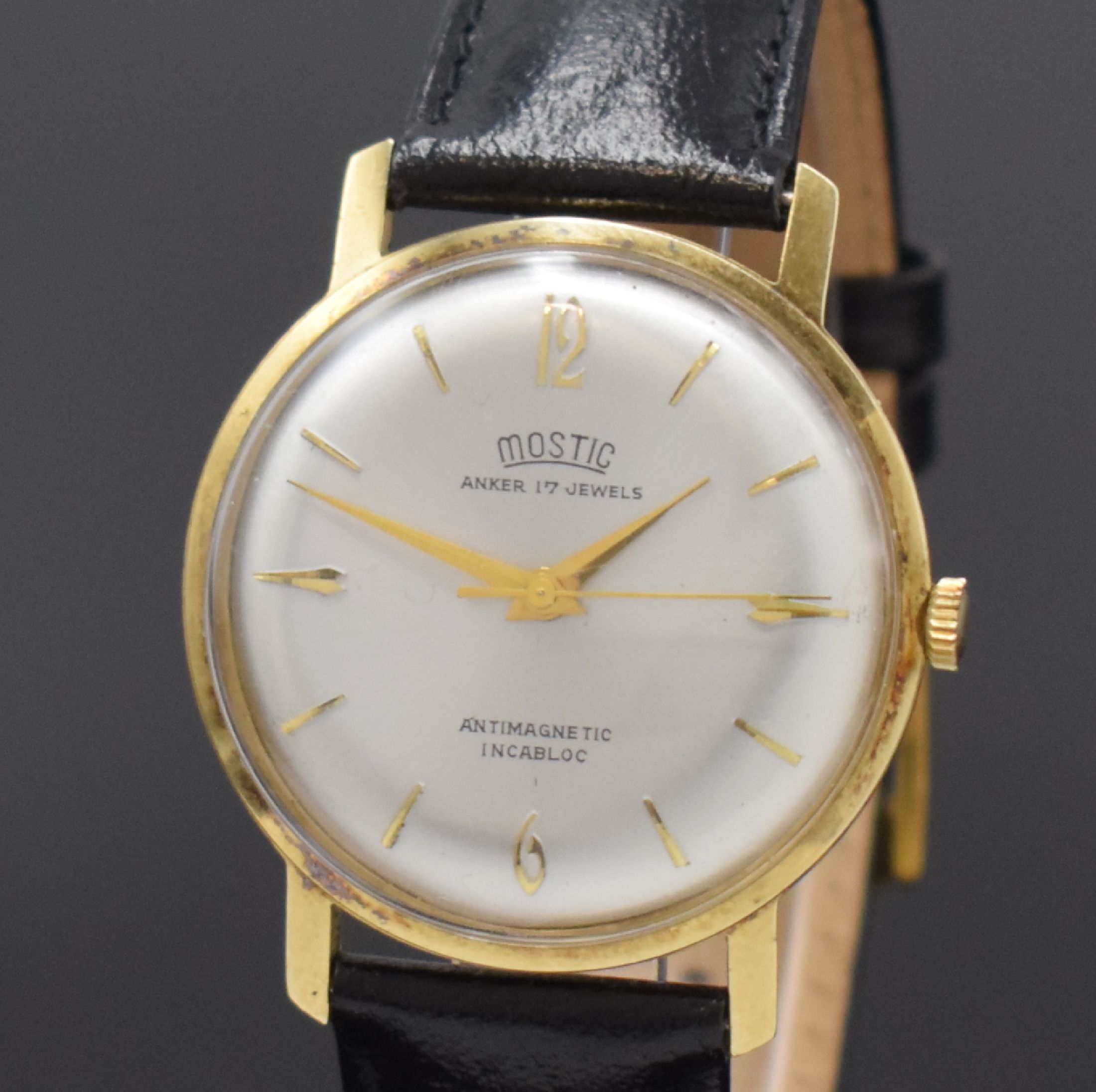 Detail a: MOSTIC Armbanduhr in GG 585/000, Schweiz um 1965, Handaufzug, gedr. Boden in Metall/GG 585/000, silb. Zifferbl. m. gold. Std.-Ind., gold. Zeiger, ...