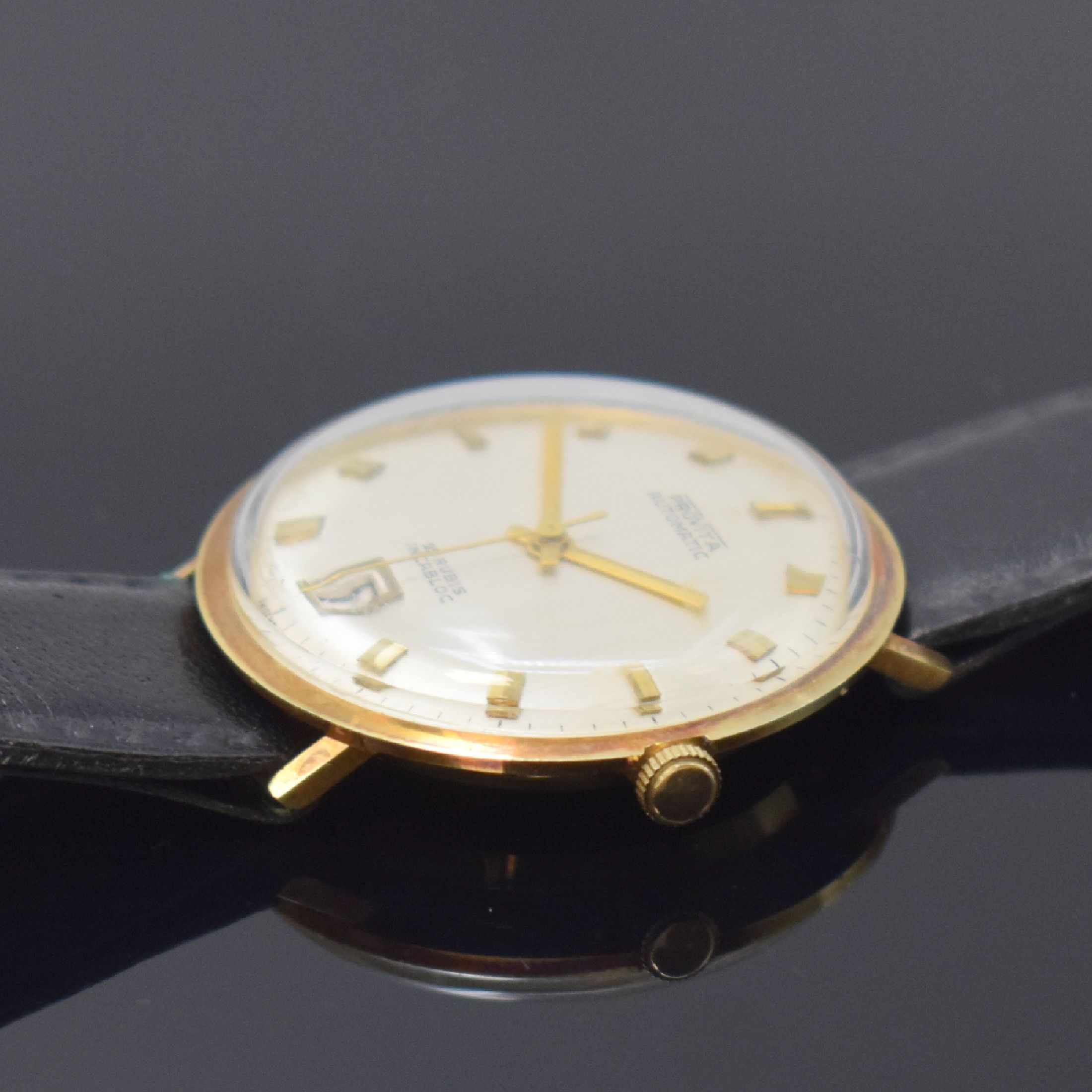 Detail b: PROVITA Herrenarmbanduhr in GG 585/000, Schweiz 1960er Jahre, Automatik, Boden aufgedr., silb. Zifferbl. m. gold. Std.-Ind., gold. Zeiger, Datum b. ...
