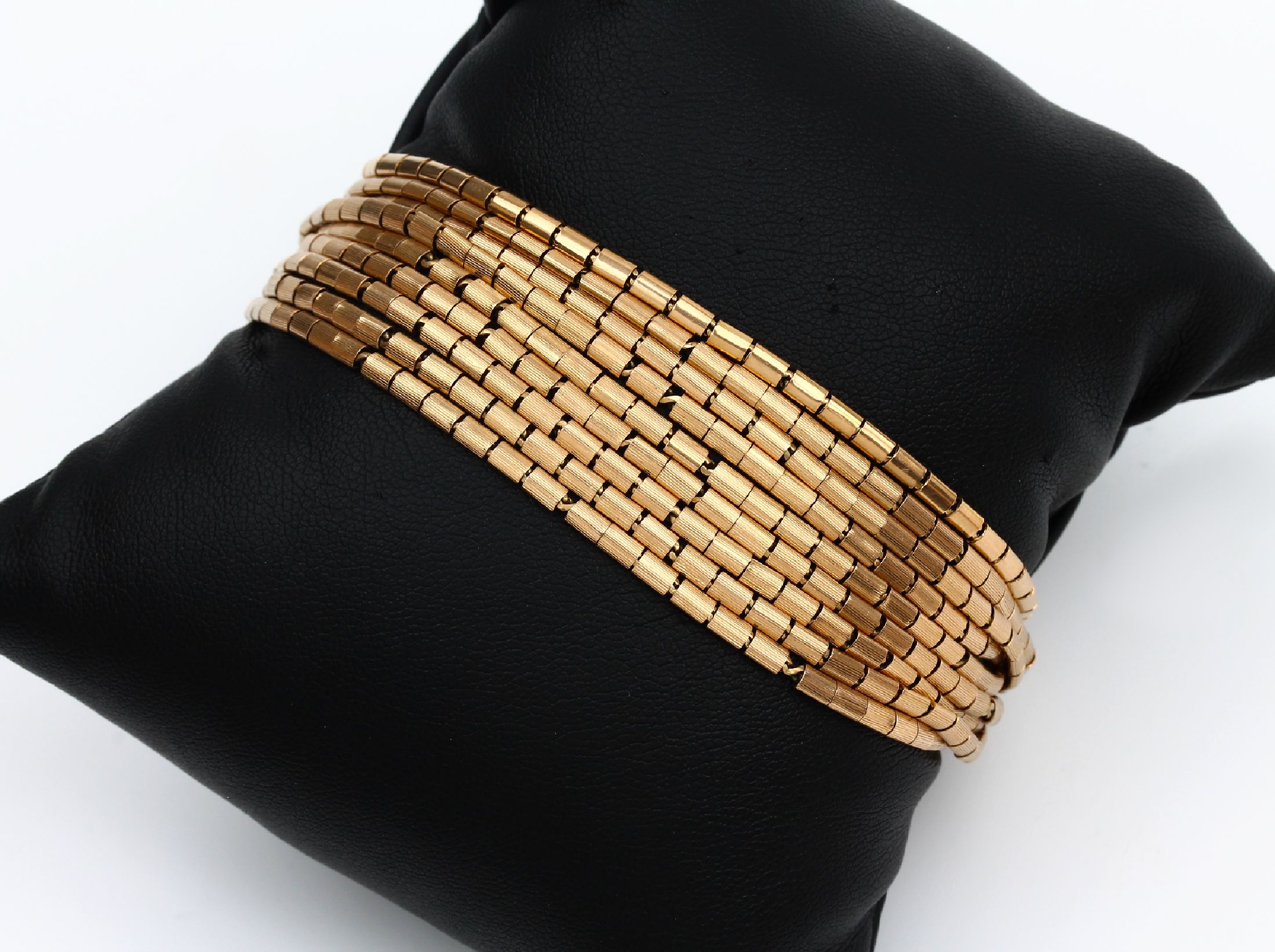 9-reihiges 18 kt Gold Armband, ca. 54.5 g, GG 750/000, Oberfläche gerieft, L. ca. 21 cm, Kastenschloss mit 2 Sicherheitsachten