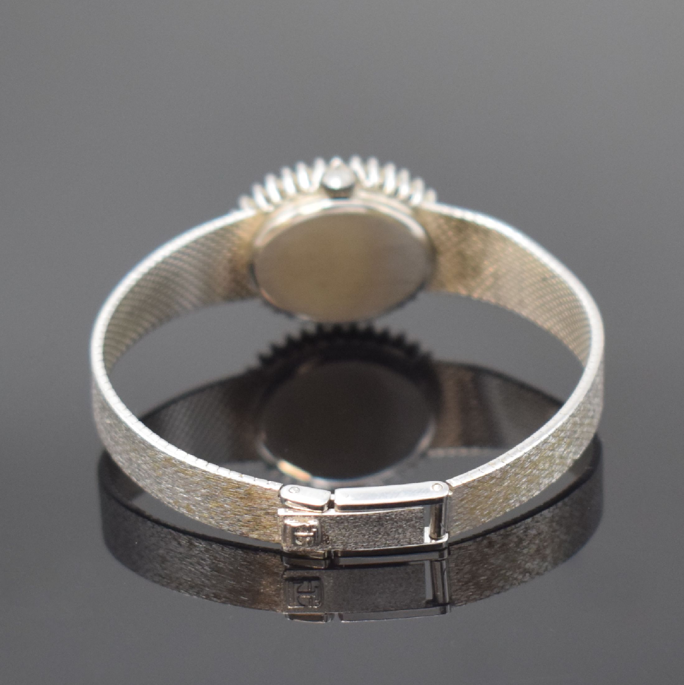 Detail b: TISSOT Damenarmbanduhr in WG 585/000 mit Diamanten, Schweiz um 1970, Handaufzug, Boden aufgedr., Lünette aufw. m. Diamanten bes., vers. Zifferbl. m. ...