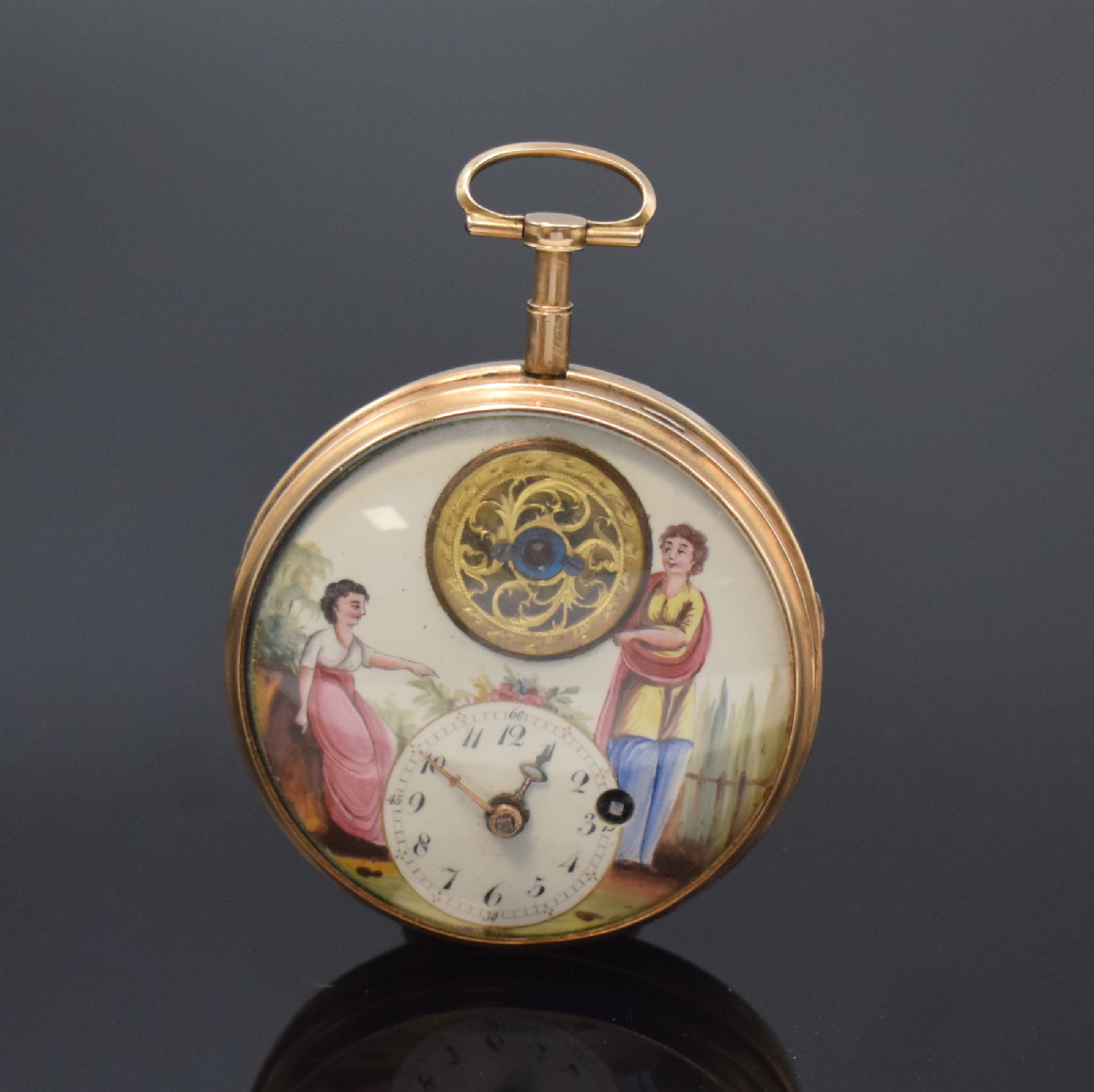 Seltene Spindeltaschenuhr mit sichtbarer Unruh in polychrom bemaltem Emailzifferblatt, um 1800, glattes Geh. dell., Zifferbl. m. figuraler Szene, b. ...