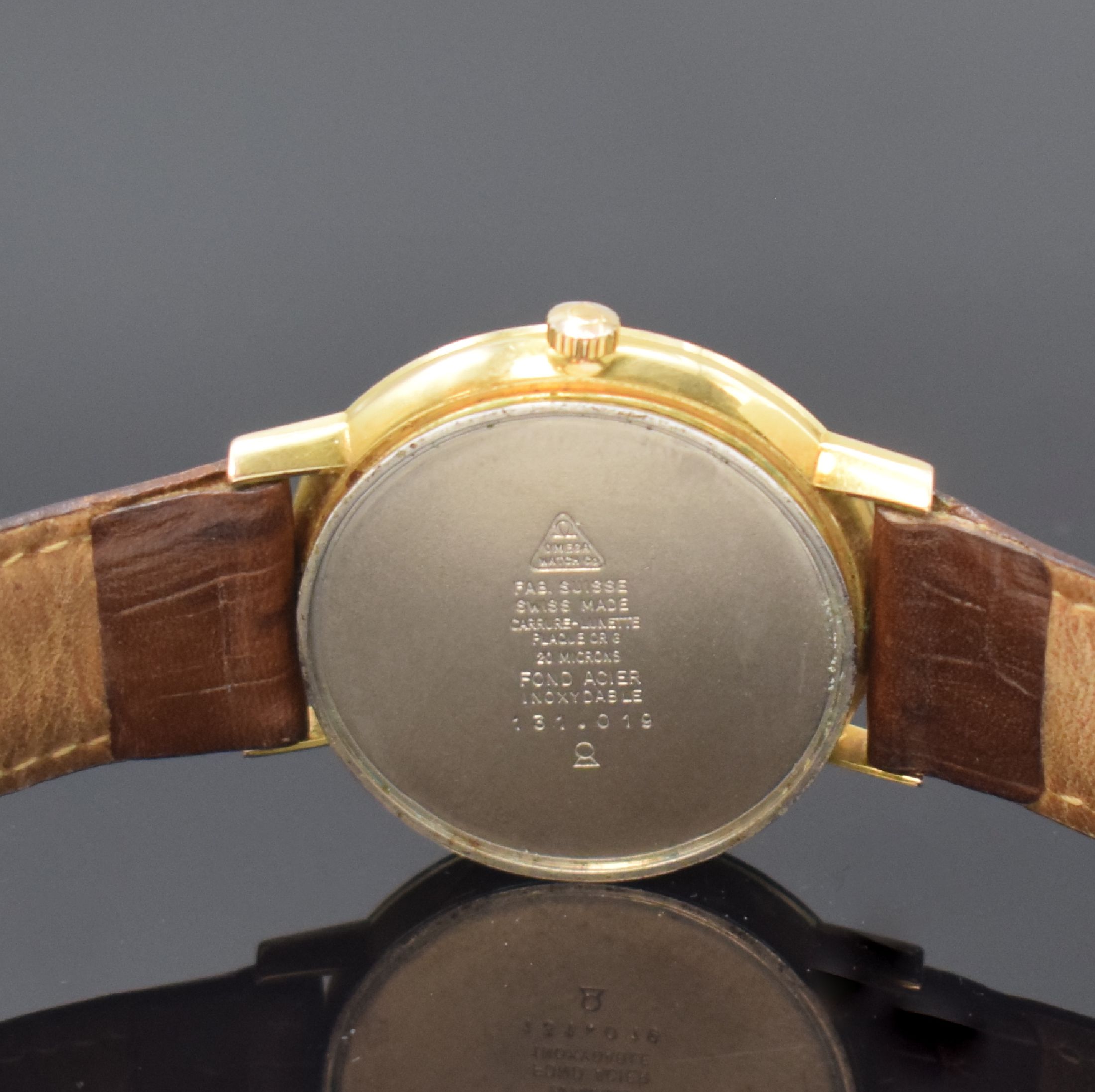 Detail e: OMEGA Herrenarmbanduhr Referenz 131.019, Handaufzug, Schweiz um 1965, verg. Geh., Edelstahlboden aufgedr., silb. Zifferblatt m. aufges. Indizes, ...