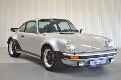 26735668c - Porsche 930 Turbo, chassis number: 9307700060, engine number: 6770053, year of manufacture 09/1976, mileage approximately 157.767 km, historic registration, 260 hp, 6-cylinder, manual transmission, silver exterior, black leather interior, equipped with air conditioning and electric sunroof. Originally delivered by Porsche Düsseldorf in Germany, it comes with the Porsche Certificate of Authenticity. This vehicle is a coveted UR- TURBO and one of only 644 produced in 1976. A Classic Data assessment from 2014/15 documents and evaluates the full restoration, including: body, paintwork, interior, fuel supply, engine, transmission, axles, brakes, electrics, wheels and tires, glass, chrome, and seals, achieving a condition rating of 1.75. Since 2017, it has been part of a private collection and has been driven less than 1,500 km in the past 7 years