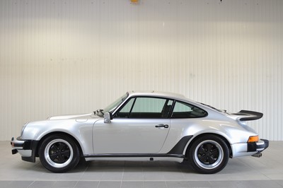 26735668e - Porsche 930 Turbo, chassis number: 9307700060, engine number: 6770053, year of manufacture 09/1976, mileage approximately 157.767 km, historic registration, 260 hp, 6-cylinder, manual transmission, silver exterior, black leather interior, equipped with air conditioning and electric sunroof. Originally delivered by Porsche Düsseldorf in Germany, it comes with the Porsche Certificate of Authenticity. This vehicle is a coveted UR- TURBO and one of only 644 produced in 1976. A Classic Data assessment from 2014/15 documents and evaluates the full restoration, including: body, paintwork, interior, fuel supply, engine, transmission, axles, brakes, electrics, wheels and tires, glass, chrome, and seals, achieving a condition rating of 1.75. Since 2017, it has been part of a private collection and has been driven less than 1,500 km in the past 7 years