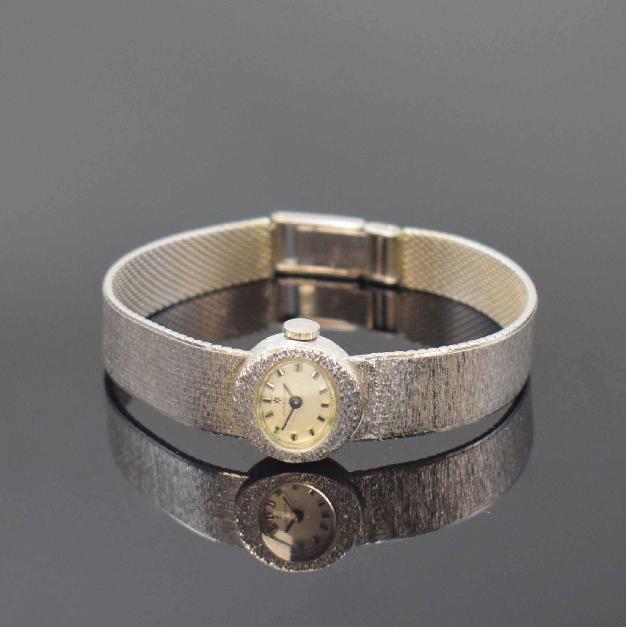 JUNGHANS Damenarmbanduhr in WG 585/000, Deutschland um 1970, Handaufzug, Boden aufgedr., silb. Zifferbl. m. aufges. Std.- Ind., geschw. Zeiger, Kal. ...