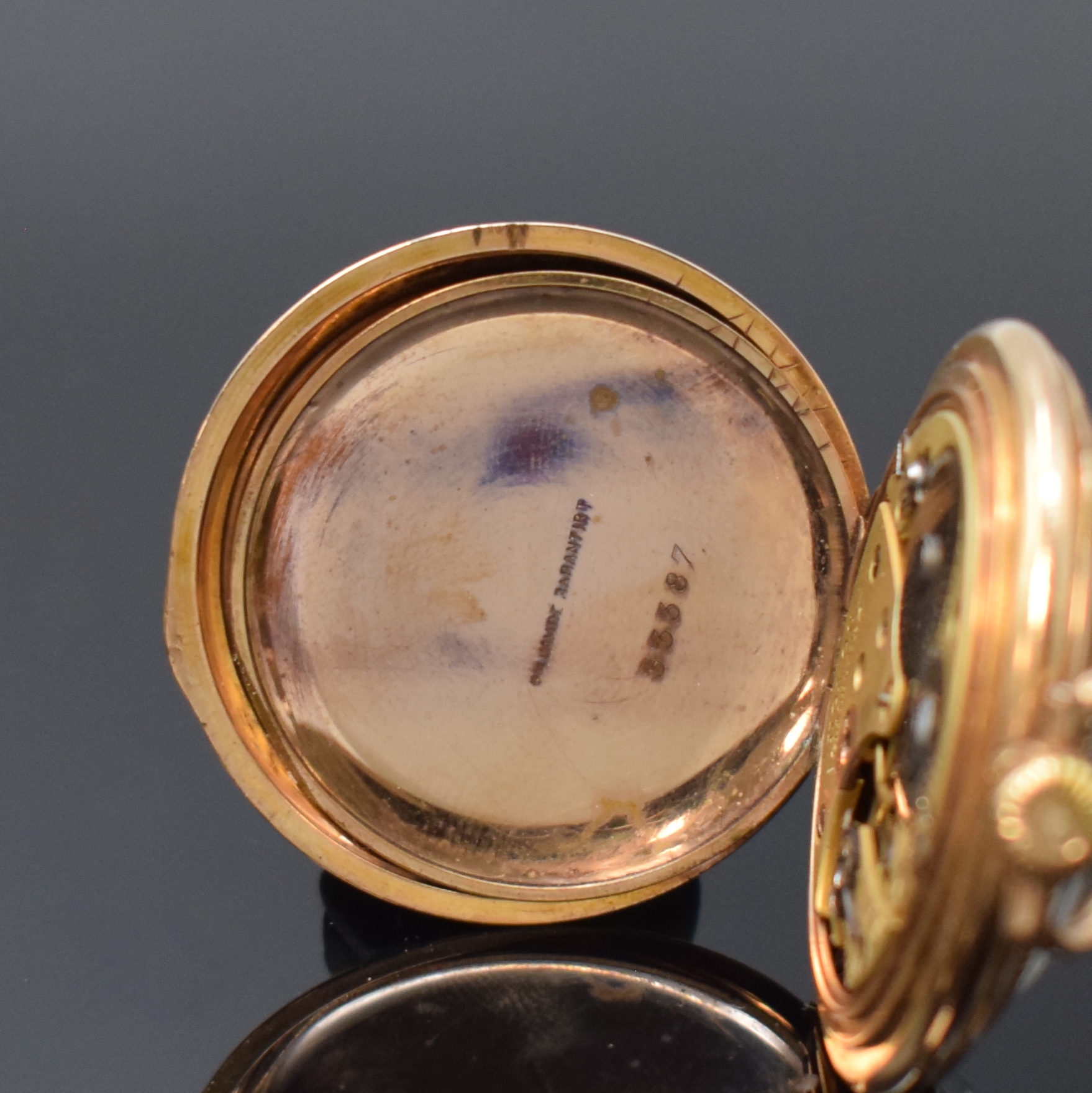 Detail d: NOMOS offene vergoldete Taschenuhr, Deutschland um 1910, verg. Geh. dell., guill. Rückdeckel, verg. Cuvette, Emailzifferbl. riss., sign. ...