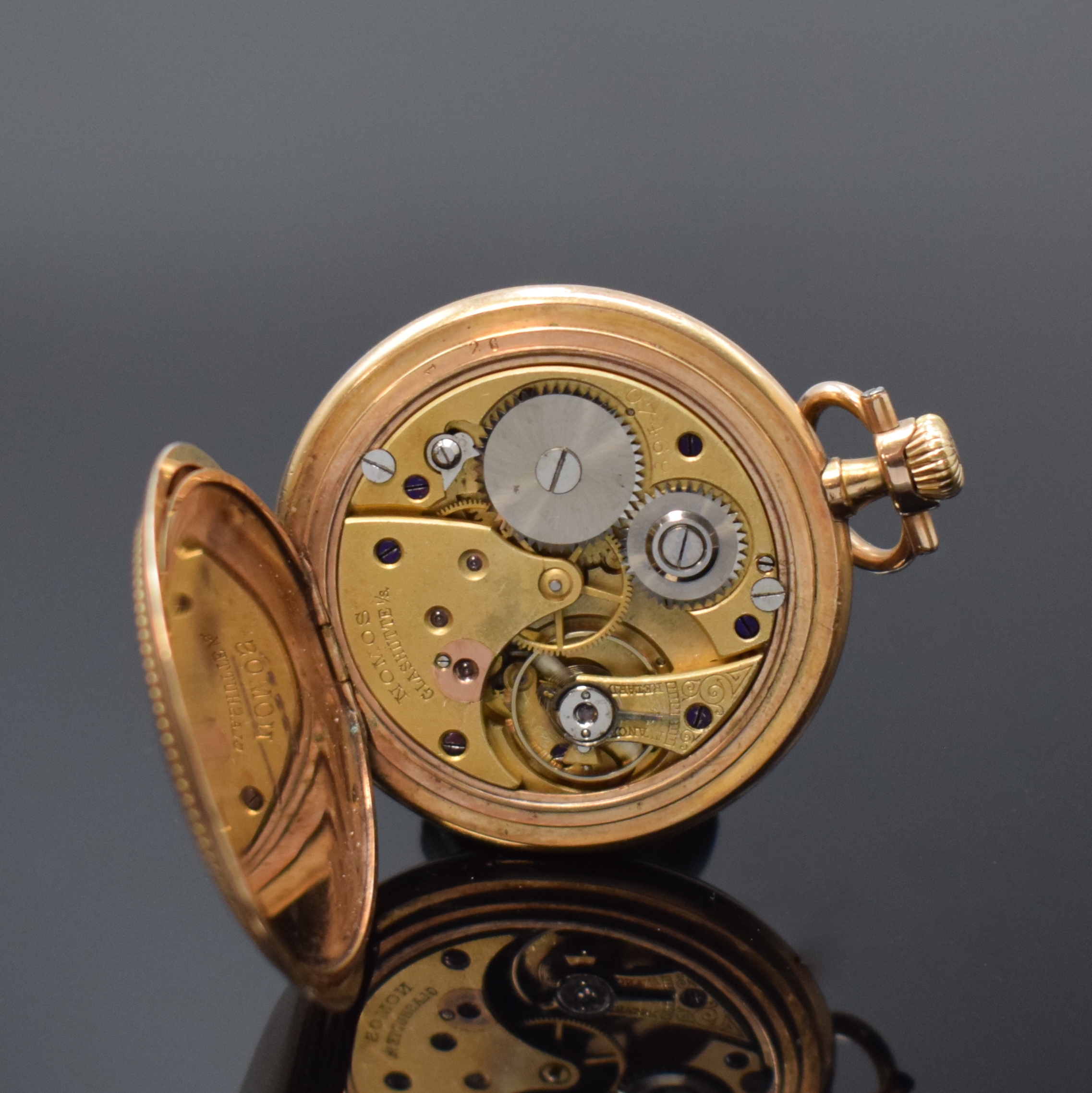 Detail e: NOMOS offene vergoldete Taschenuhr, Deutschland um 1910, verg. Geh. dell., guill. Rückdeckel, verg. Cuvette, Emailzifferbl. riss., sign. ...