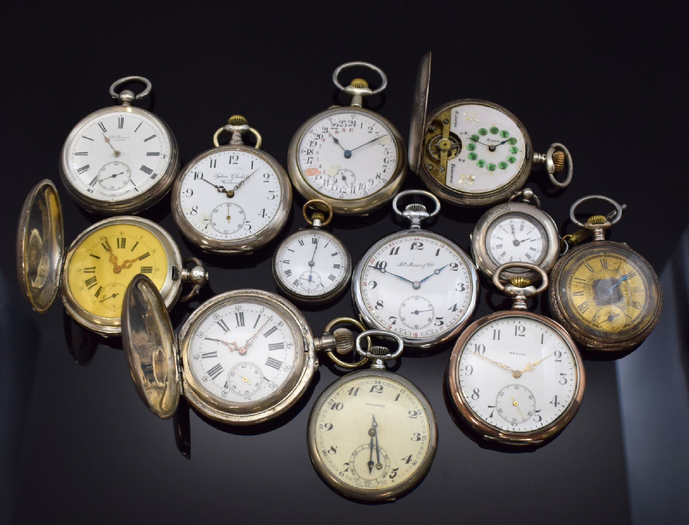 12 Taschenuhren darunter Zenith, Movado, Hebdomas, H.Moser & Cie, Schweiz/England um 1870-1920, Schlüssel u. Kronenaufzug, Offene Geh. u. Savonette ...