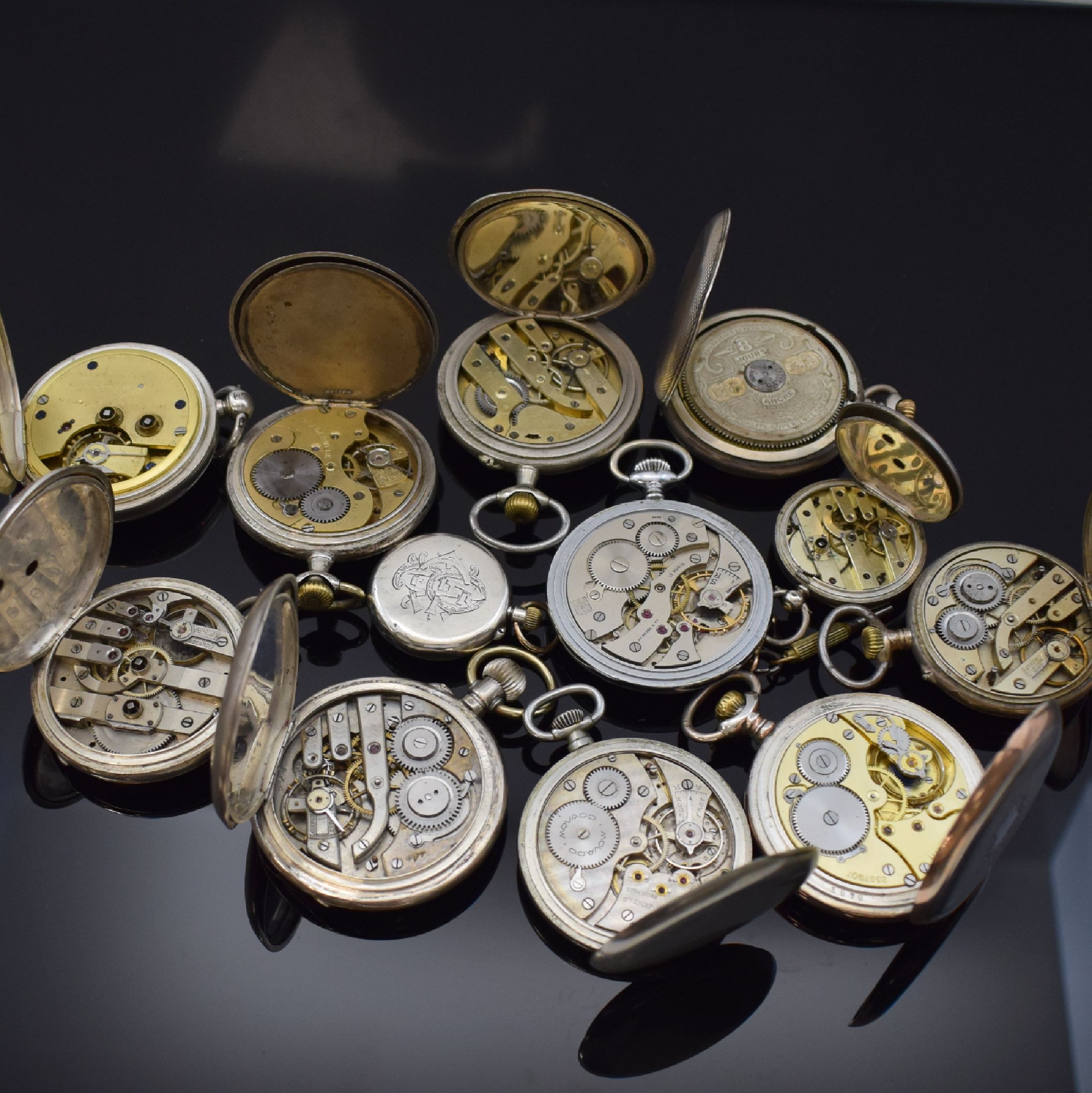 Detail b: 12 Taschenuhren darunter Zenith, Movado, Hebdomas, H.Moser & Cie, Schweiz/England um 1870-1920, Schlüssel u. Kronenaufzug, Offene Geh. u. Savonette ...