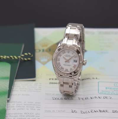 Image ROLEX 18k white gold ladies wristwatch Oyster Perpetual Datejust Pearlmaster, self winding, reference 80319, D-series, superlative chronometer officially certified, white gold 18k Pearlmaster bracelet with deployant clasp, screwed down case back and winding crown, bezel lavish with 12 diamonds set, white dial with Roman hour-indices, display of hours, minutes, sweep seconds and date under sapphire loupe glass, diameter approx. 29 mm, length approx. 17,5 cm, papers enclosed, condition 2