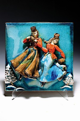 Image 26737274 - Ceramic relief picture, Ilse Köhler- Hohenreuther (1911-1952), Karlsruhe majolica, pair of ladies in traditional costumes skatingin a winter landscape, colored glazed, signed and dated 1949 on the reverse, traces of age, 31x31 cm