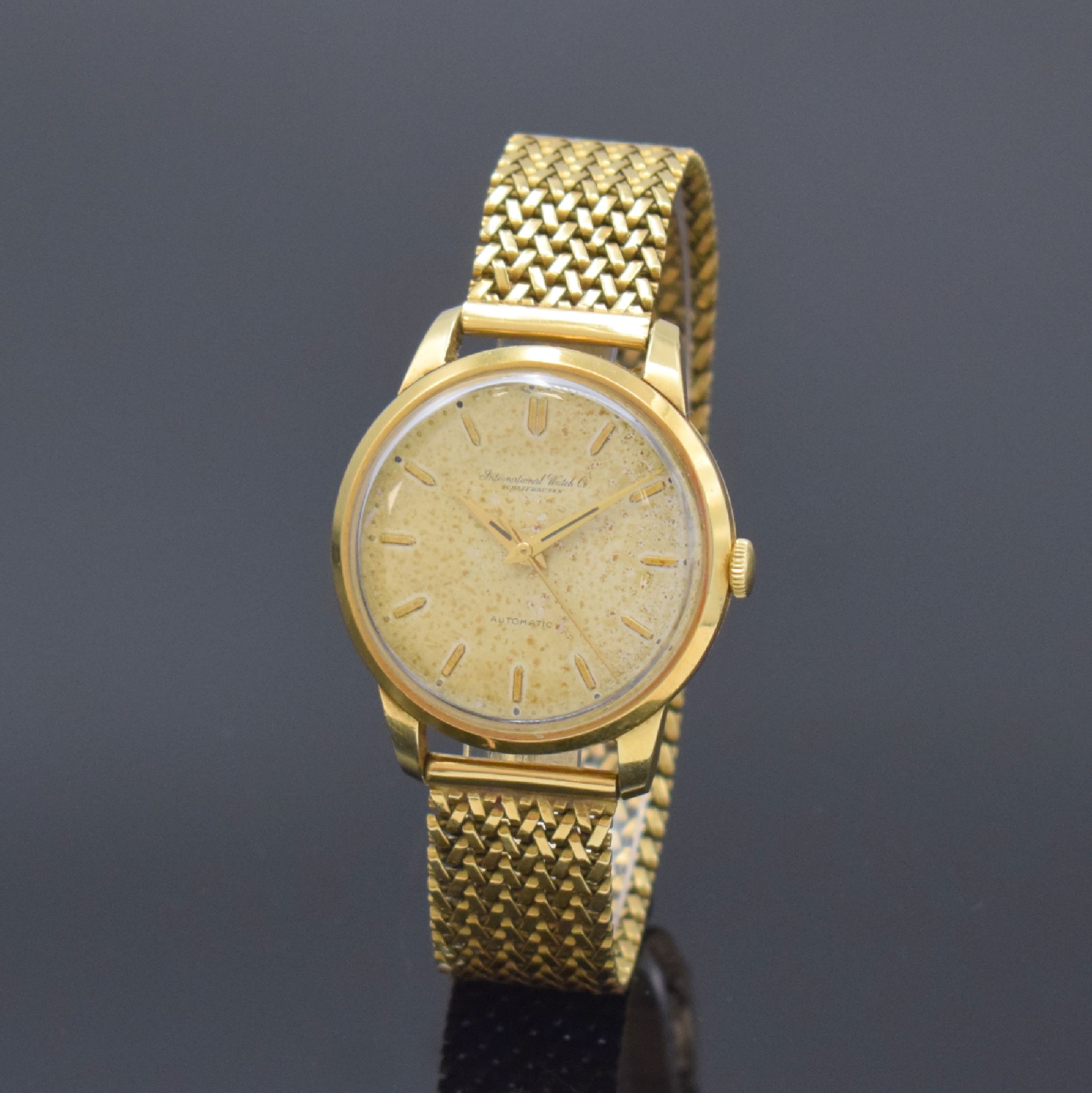 IWC Herrenarmbanduhr in GG 750/000, Schweiz um 1957, Automatik, 3-teil. Geh., neutr. GG 750/000 Gliederband, Boden und Glasrand aufgedr., silb. ...