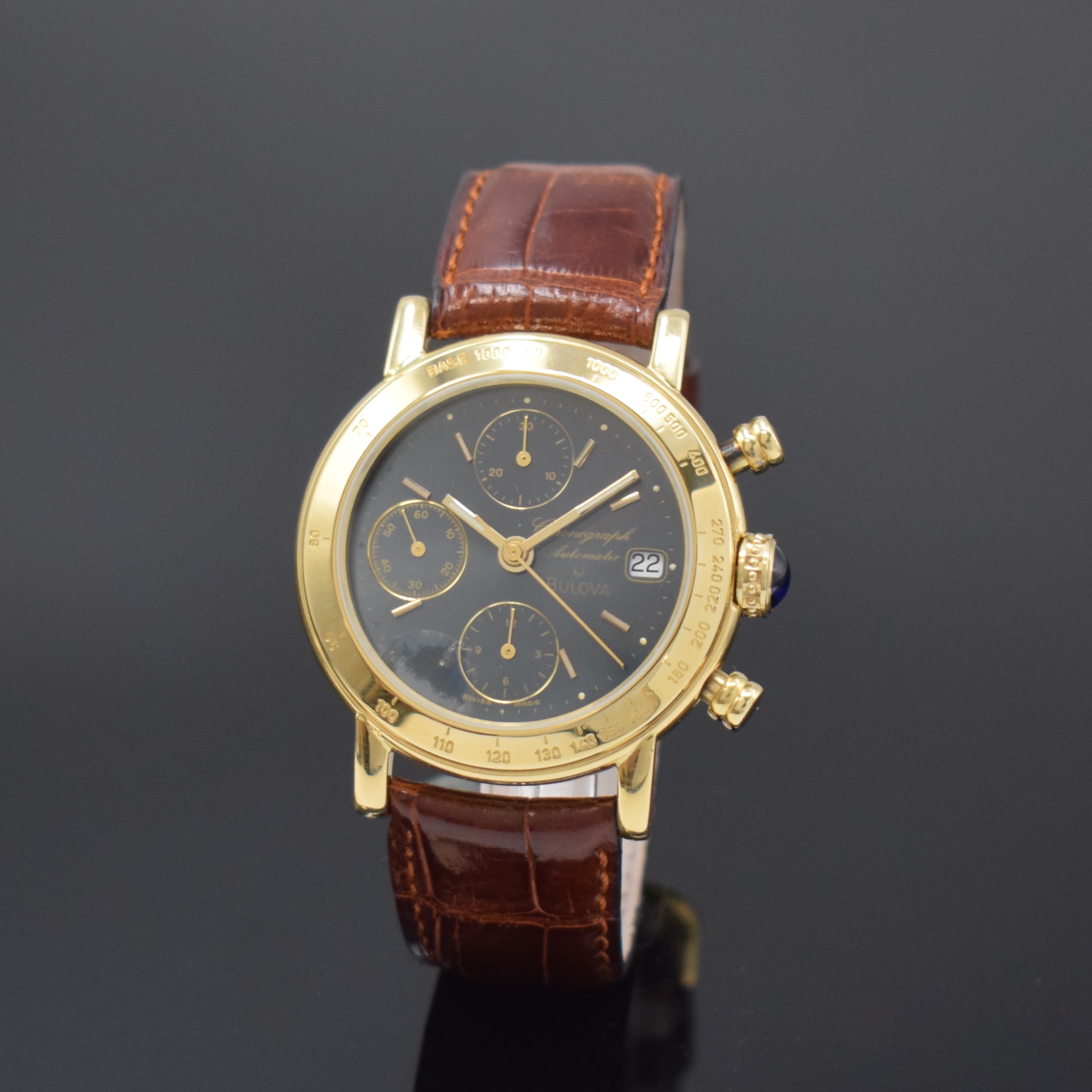 BULOVA Armbandchronograph in GG 750/000, Schweiz um 2005, Automatik, Boden aufgedr., Lünette m. Tachymeterskala grav., Schmuckkrone, dunkelgraues ...
