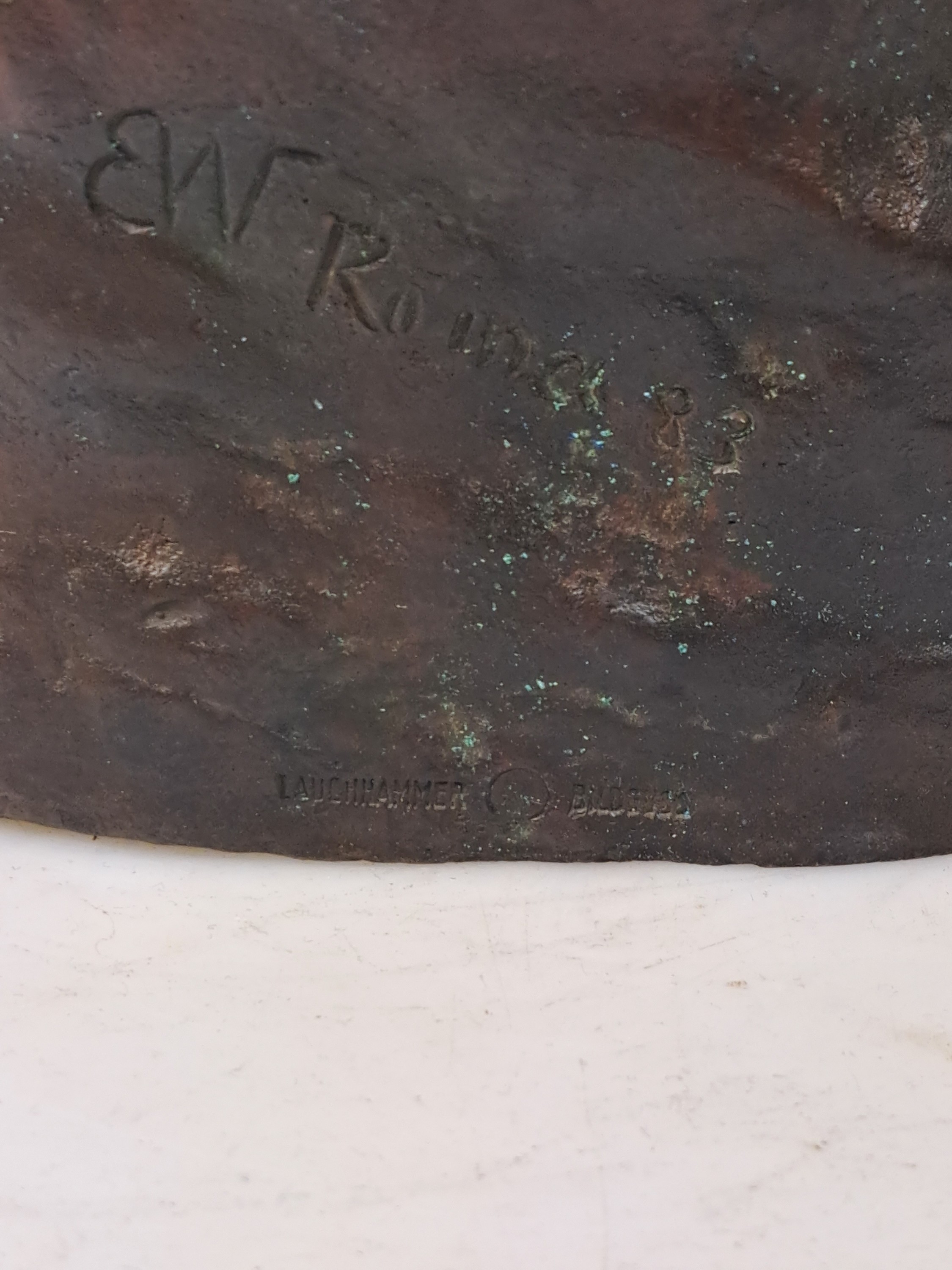 Detail h: Monogrammist EW, Bronzeplastik, braun patiniert, auf einem Fels sitzender Faun, rückseitig monogrammiert und bezeichnet "EW Roma (18)83", ...