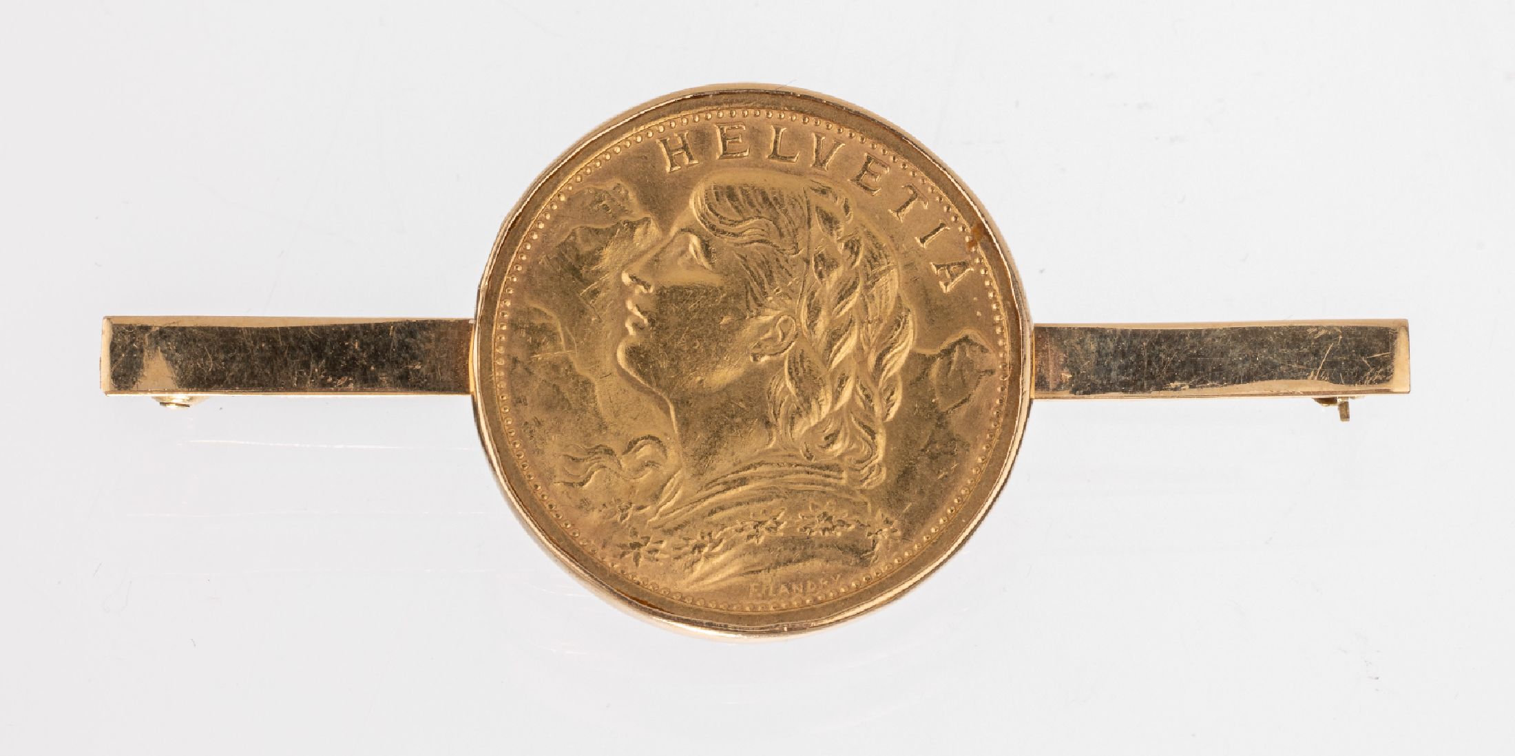 14 kt Gold Münz-Brosche, GG 585/000 gepr., schlicht, mittig lose gefasste Goldmünze, 20 Franken, Schweiz 1911, sogn. Vreneli, L. ca. 5cm, ca. 10.2 ...