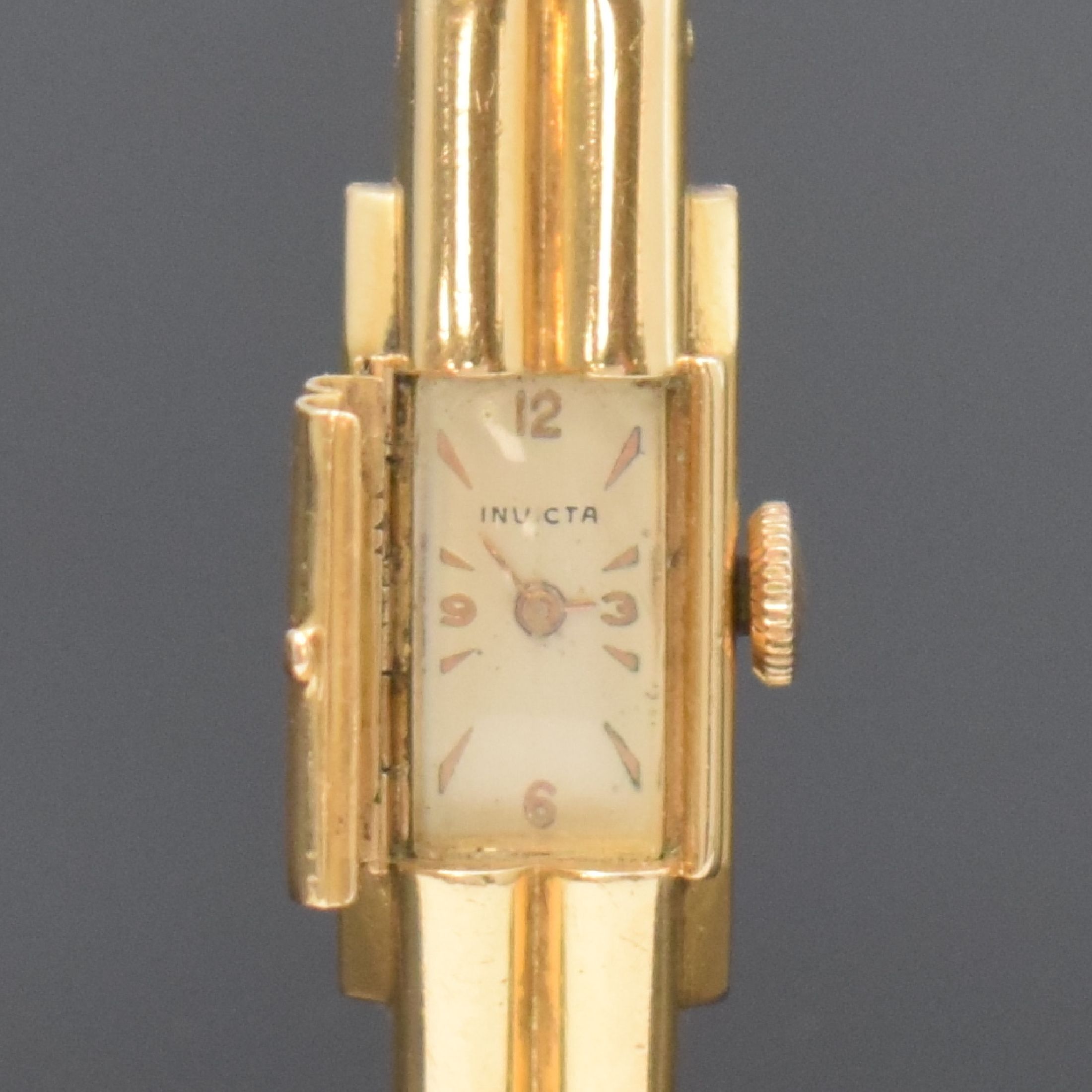 Detail a: INVICTA Damenspangenuhr in GG 750/000, Schweiz um 1940, Handaufzug, Boden aufgedr., silb. Zifferbl. pat./fl., gold. Ind. u. arab. Zahlen, gold. ...