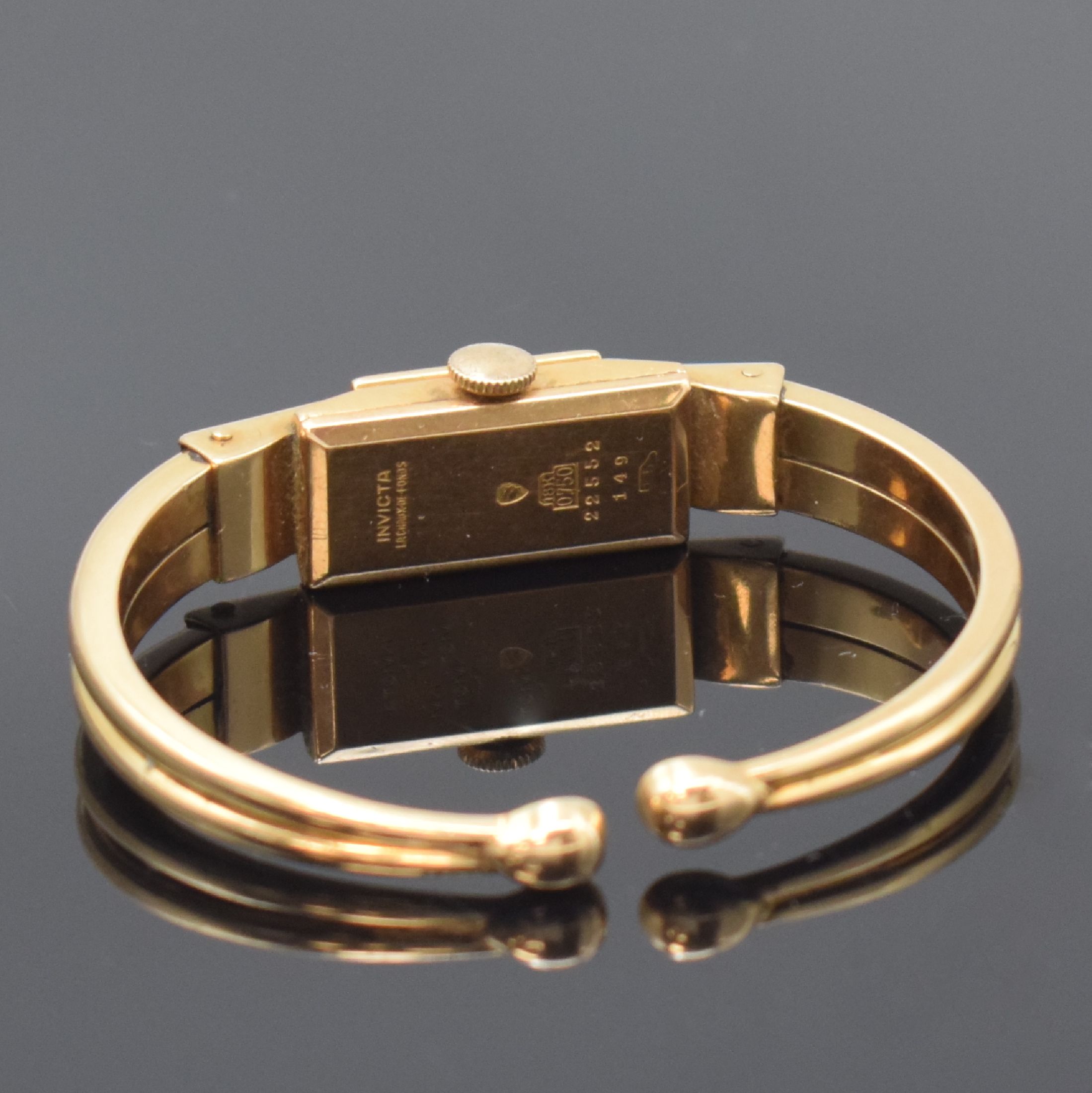 Detail c: INVICTA Damenspangenuhr in GG 750/000, Schweiz um 1940, Handaufzug, Boden aufgedr., silb. Zifferbl. pat./fl., gold. Ind. u. arab. Zahlen, gold. ...