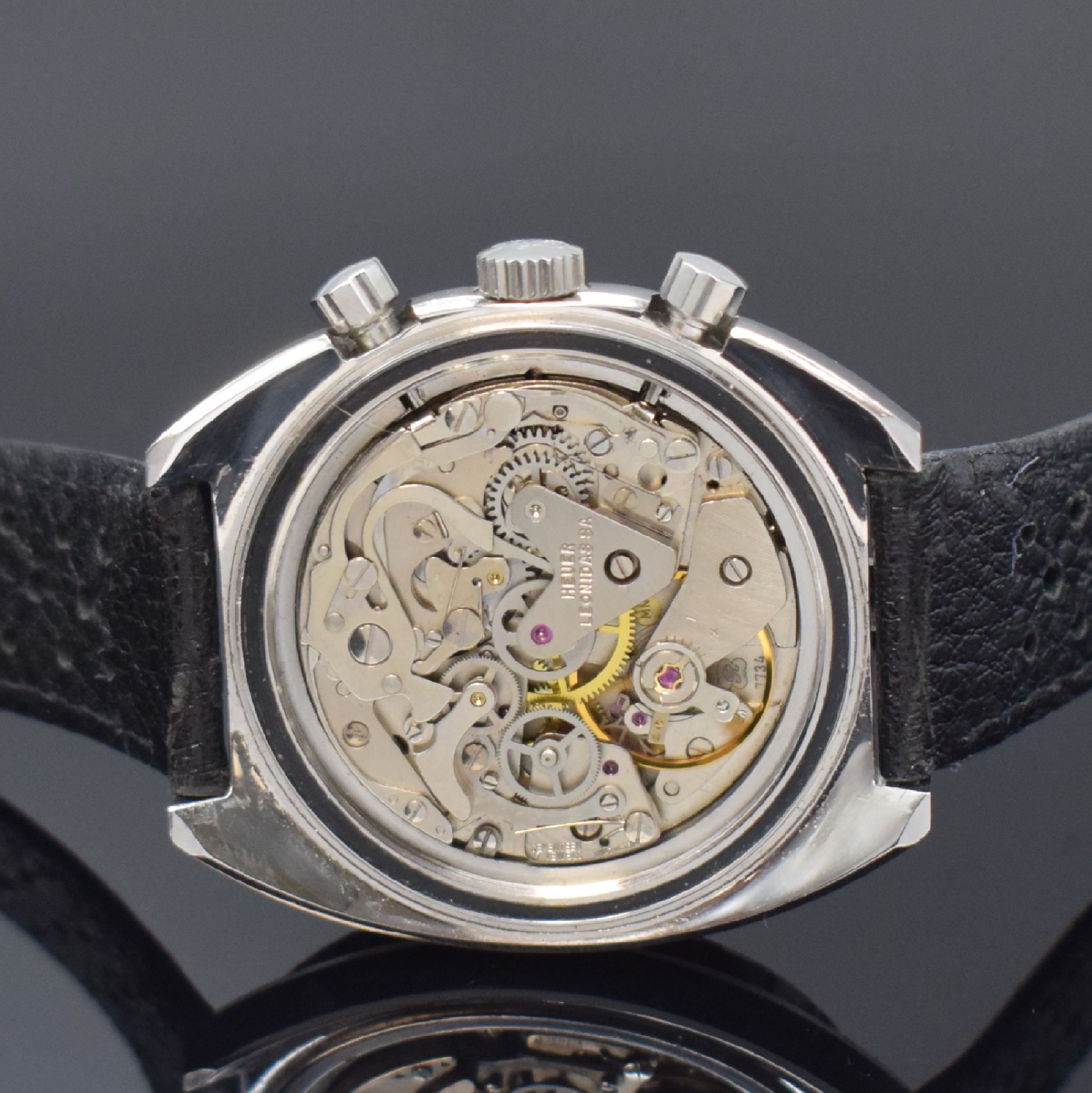 Detail d: HEUER Autavia Herrenchronograph Referenz 73463 in Stahl, Schweiz um 1972, Handaufzug, Lederband m. orig. Dornschl., Boden verschr., Lünette m. 60er ...