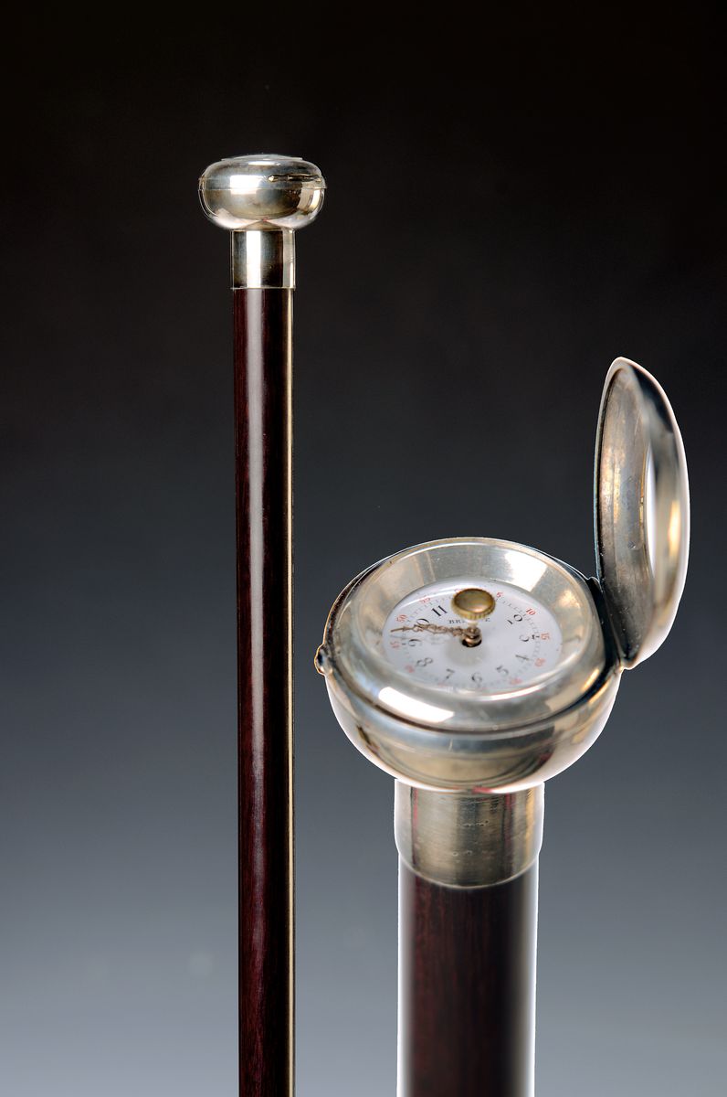 Systemstock mit Uhr, wohl Frankreich, Anfang 20.Jh., Holzstock, Silbermontur ungemarkt, Zifferblatt mit Brevete, Sprungdeckel Mechanismus, ...