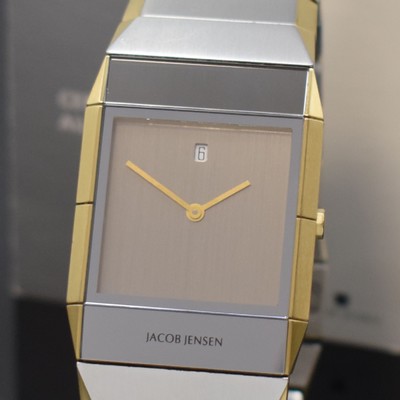 26745184a - JACOB JENSEN design-wristwatch reference 553 in steel, Switzerland according to original papers sold in 2018, quartz, rectangular case, integrated solid bracelet with butterfly clasp, bracelet and case with gold plated edges, silvered dial, gilded hands, date at 12, measures approx. 38,5 x 30 mm, length approx. 19 cm, condition 2