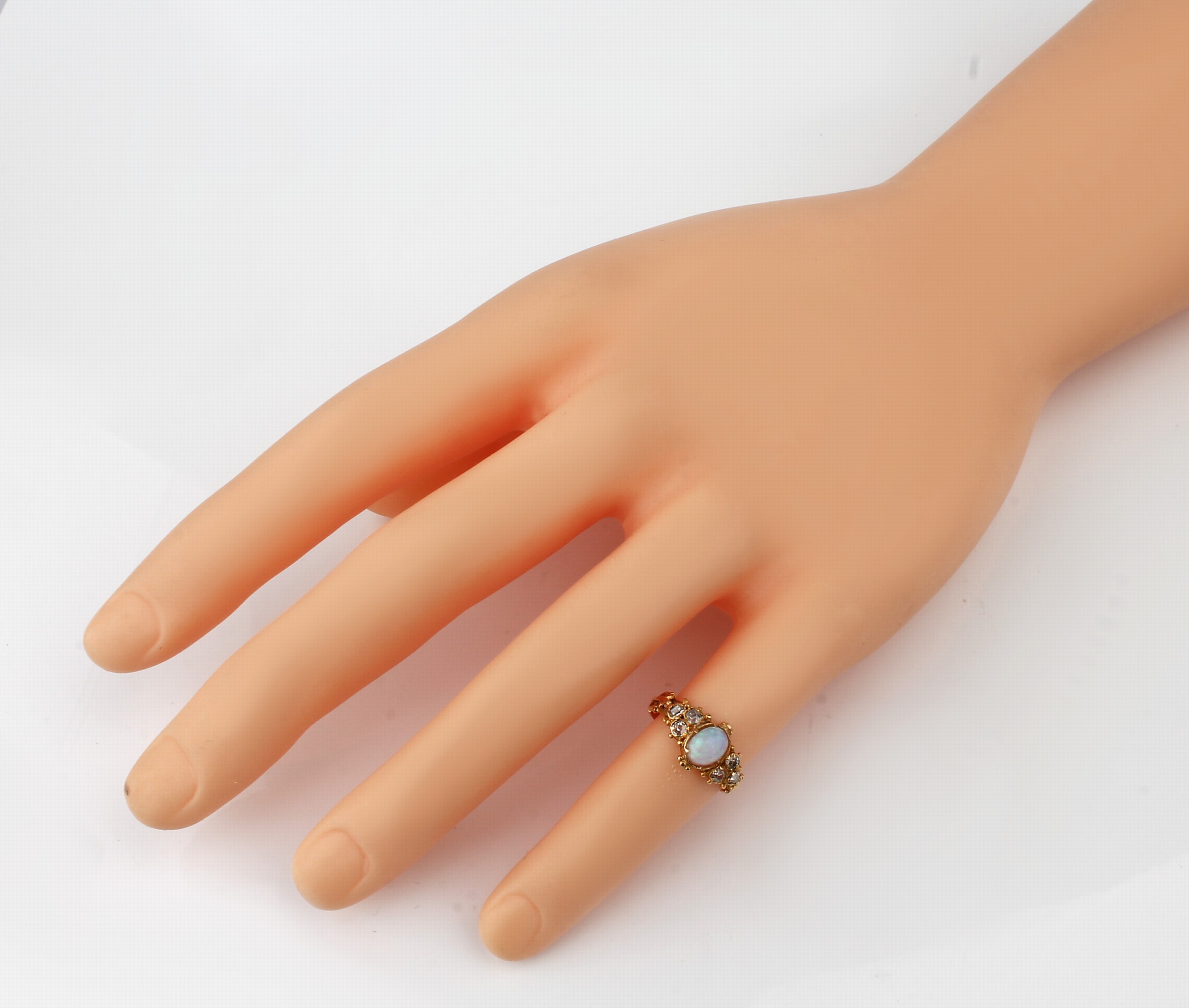 Detail a: 14 kt Gold Opal-Diamant-Ring, um 1870, GG 585/000 gepr., mittig ovaler Opal-Cabochon ca.0.40 ct, 5 Altschliffdiamanten und 1 Baguette (sek.) zus. ...