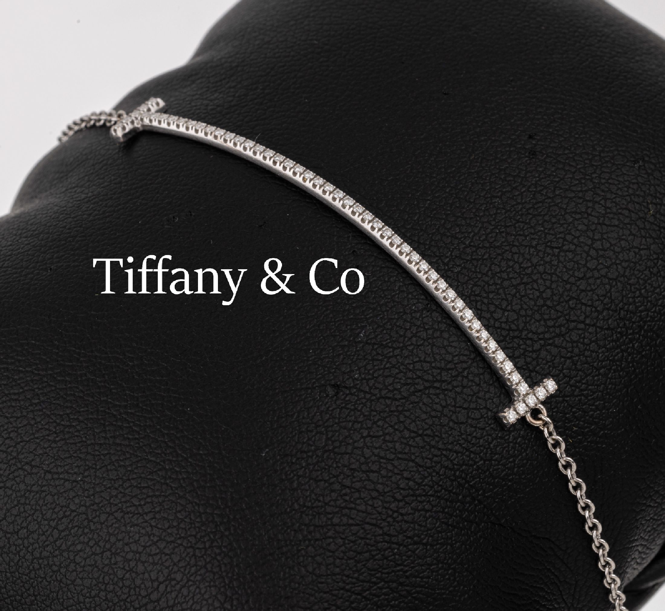 18 kt Gold TIFFANY & CO Brillant-Armband, WG 750/000, Brillanten zus. ca. 0.40 ct Weiß/si, L. ca. 17-18 cm, Federringschließe, sign., in orig. ...