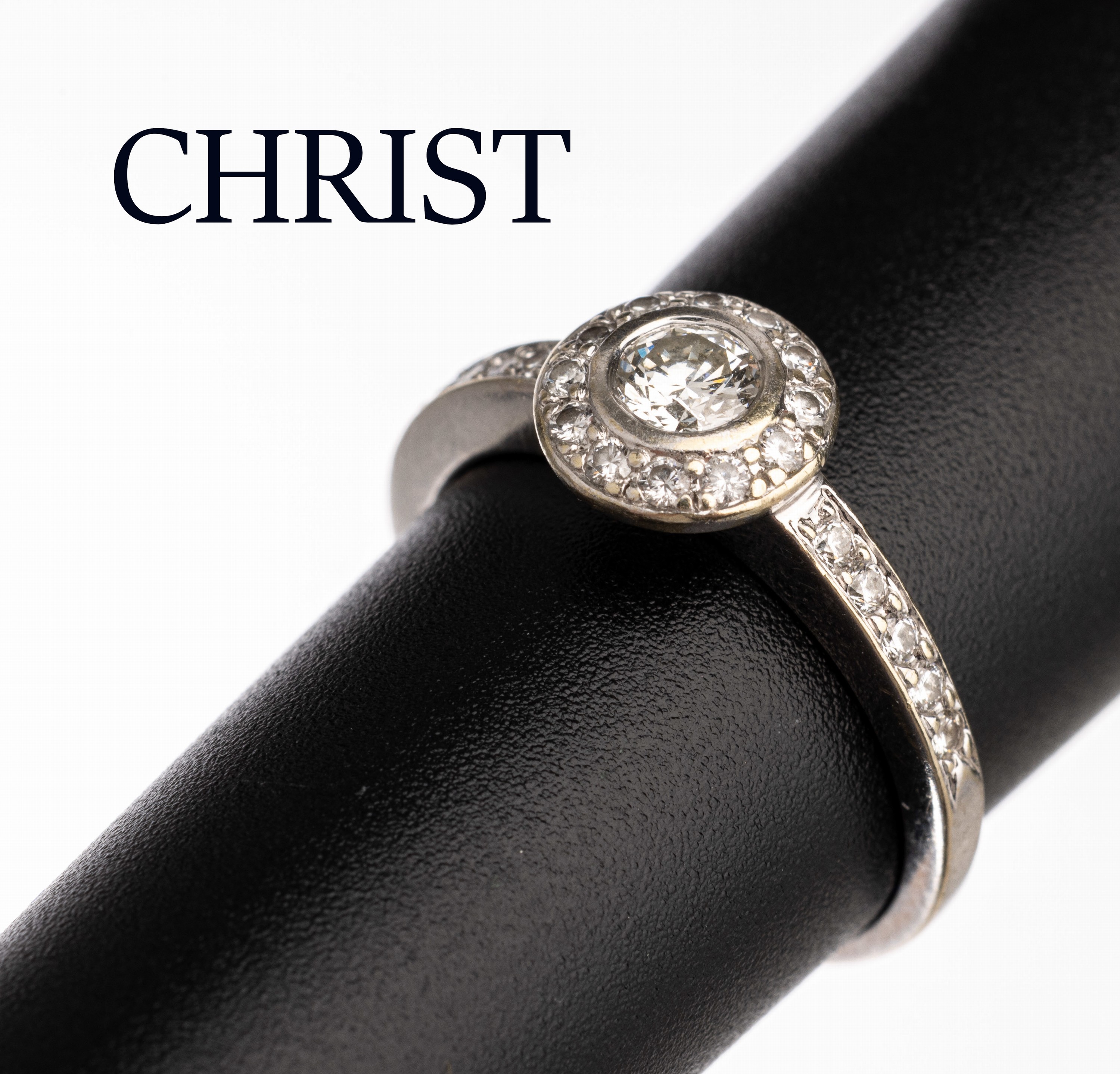 14 kt Gold CHRIST Brillant-Ring, WG 585/000, mittiger Brillant ca. 0.40 ct Weiß/vs, Ringkopf und Schultern bes. mit weiteren Brillanten zus. ca. ...
