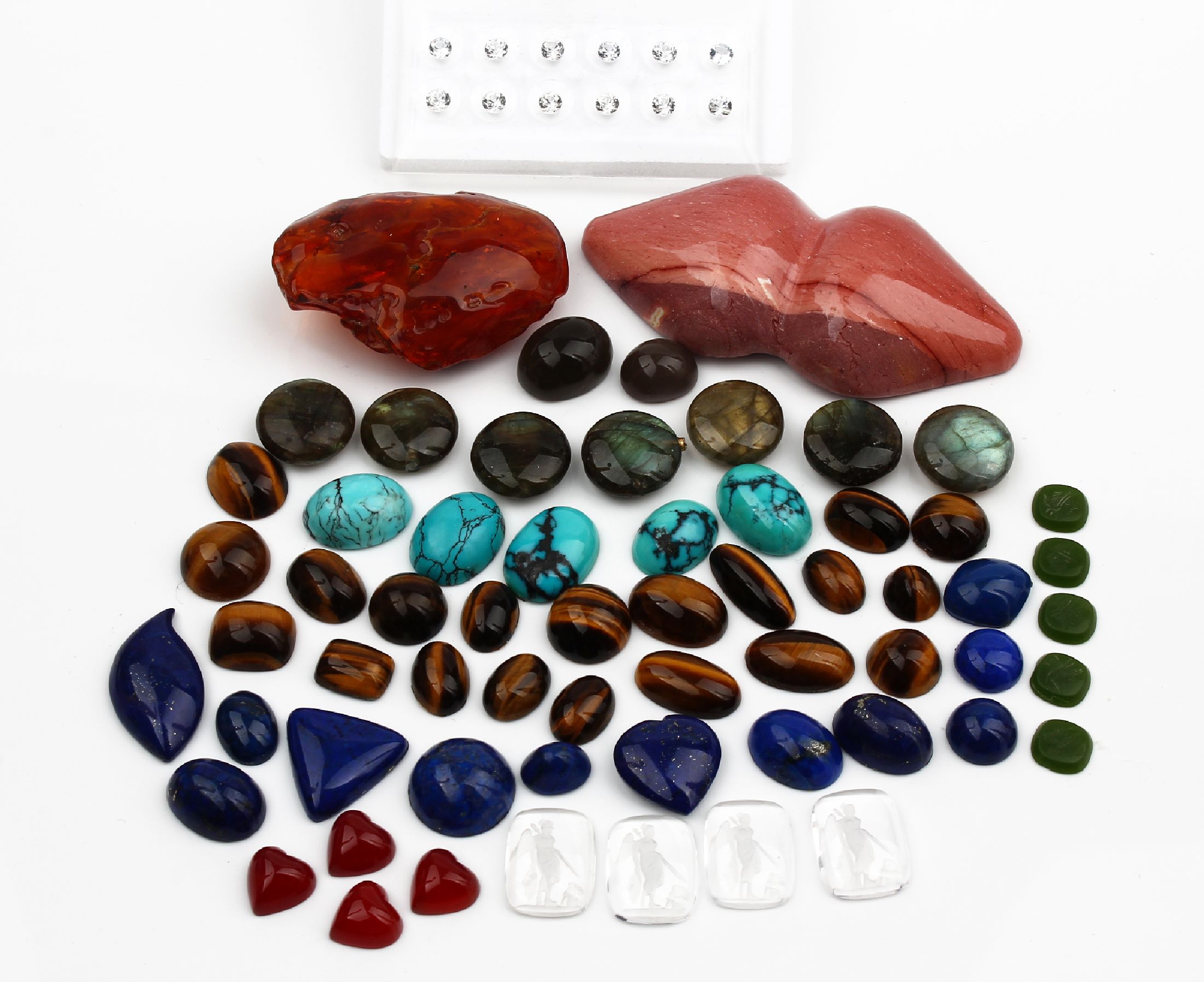 Lot lose Farbsteine, ca. 1120 ct, u.a. Türkis, Lapislazuli, weiße Saphire, Karneol, Bergkristall, Tigerauge und Bernstein, versch.Schliffformen ...